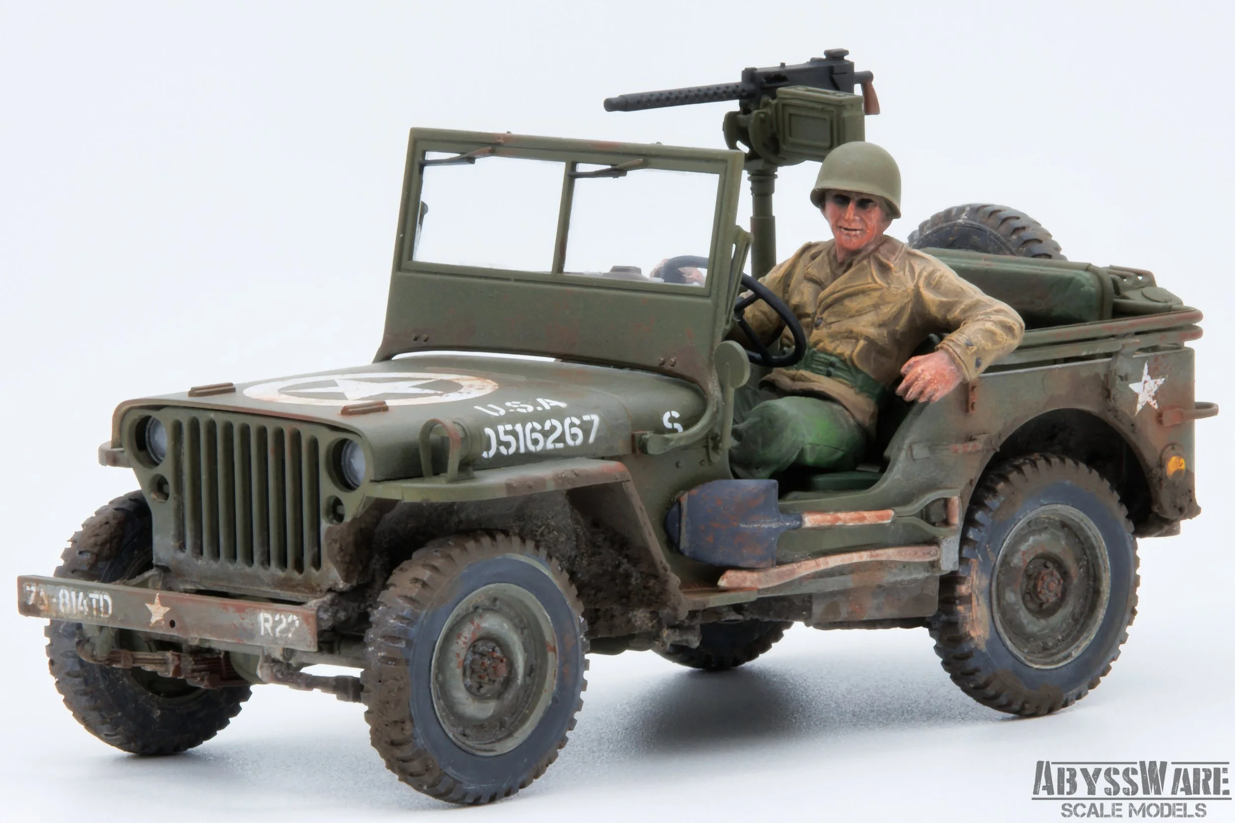 Scale model of a World War II military jeep with a soldier figure inside, equipped with a mounted machine gun, against a plain white background.
