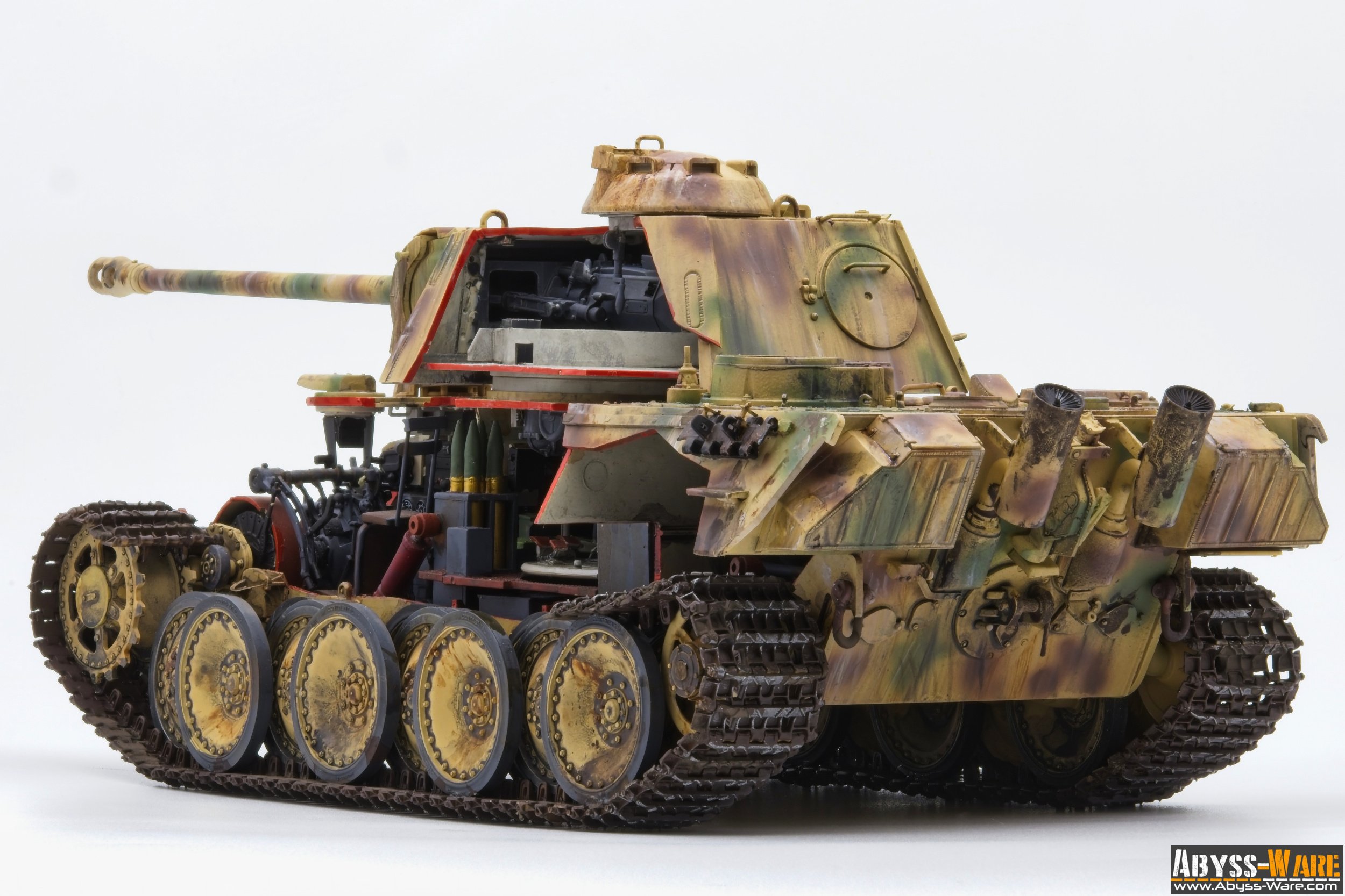 Model of a military tank with camouflage paint, showing its gun barrel, turret, and tracks on a white background.