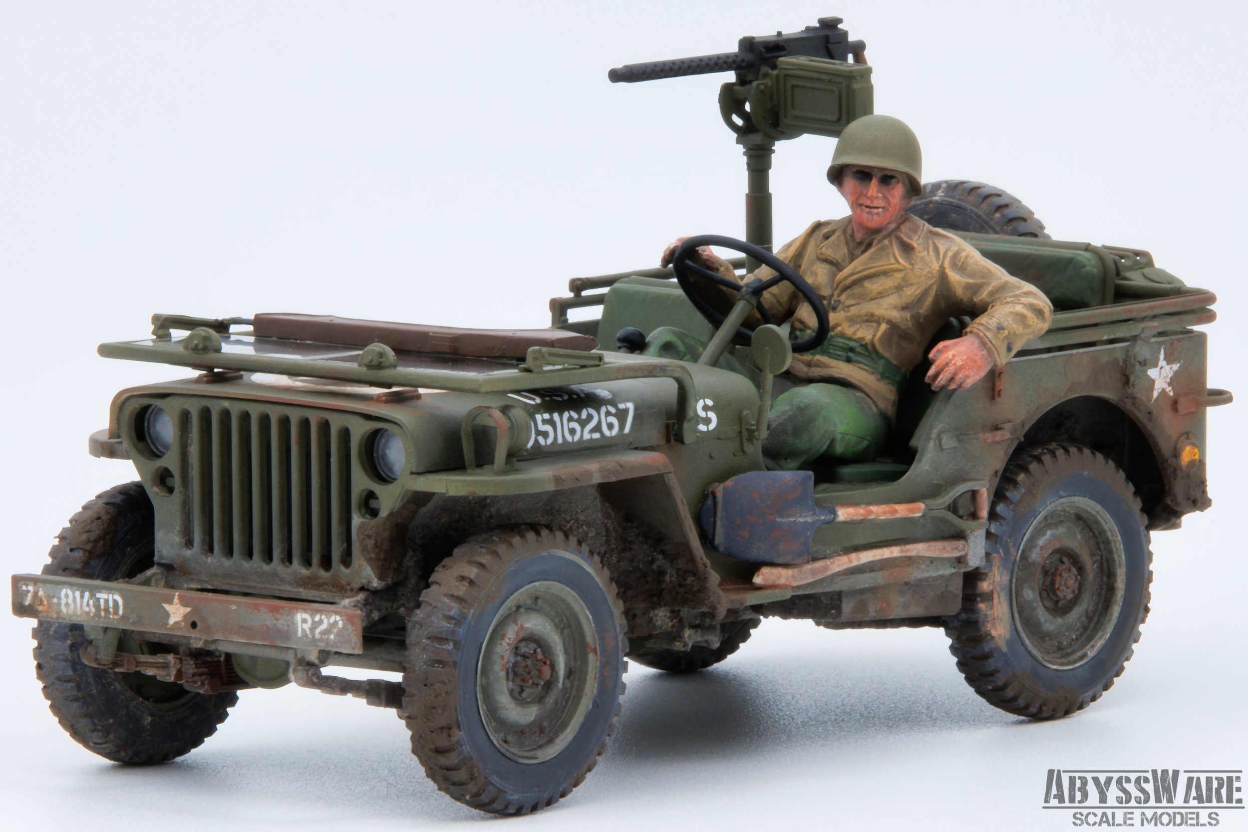 A scale model of a military jeep with a soldier figure, detailed with realistic weathering and accessories, photographed against a plain background.
