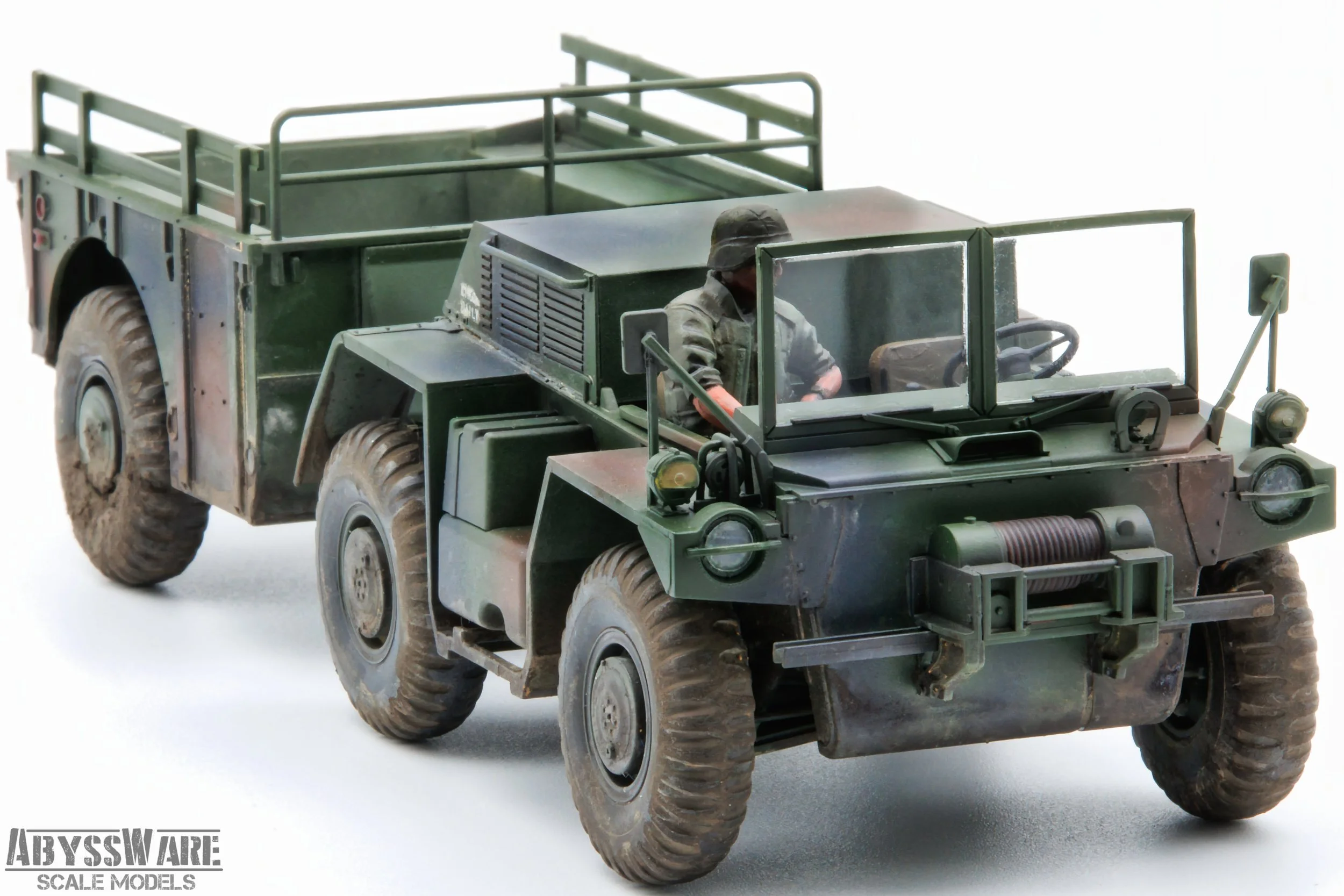 A detailed model of a military green all-terrain vehicle with a soldier figure inside, part of AbyssWares Scale Models, on a white background.