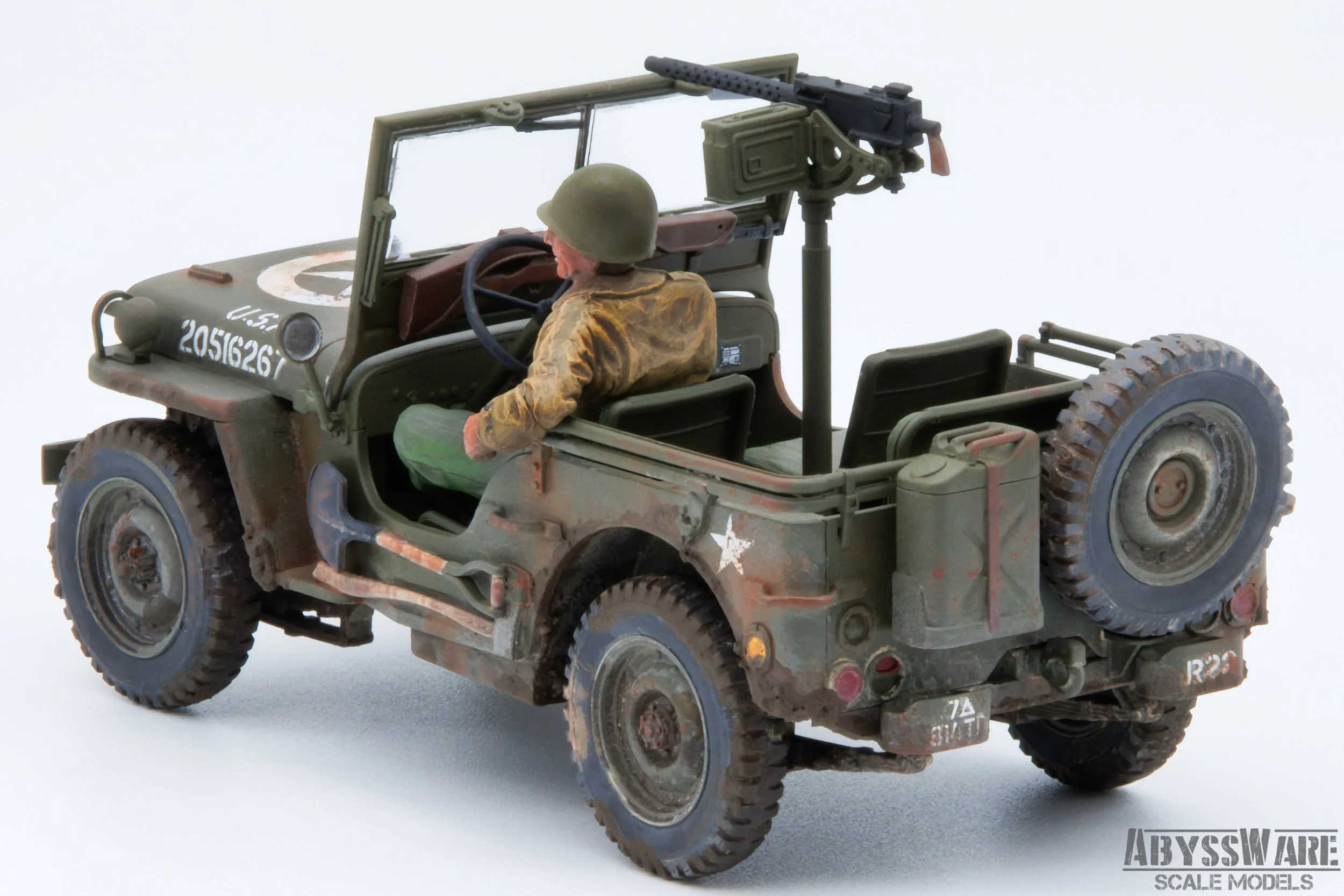 Scale model of a military Jeep with a soldier figure wearing a helmet and sitting in the driver seat, equipped with a mounted machine gun on the back, set against a plain white background.