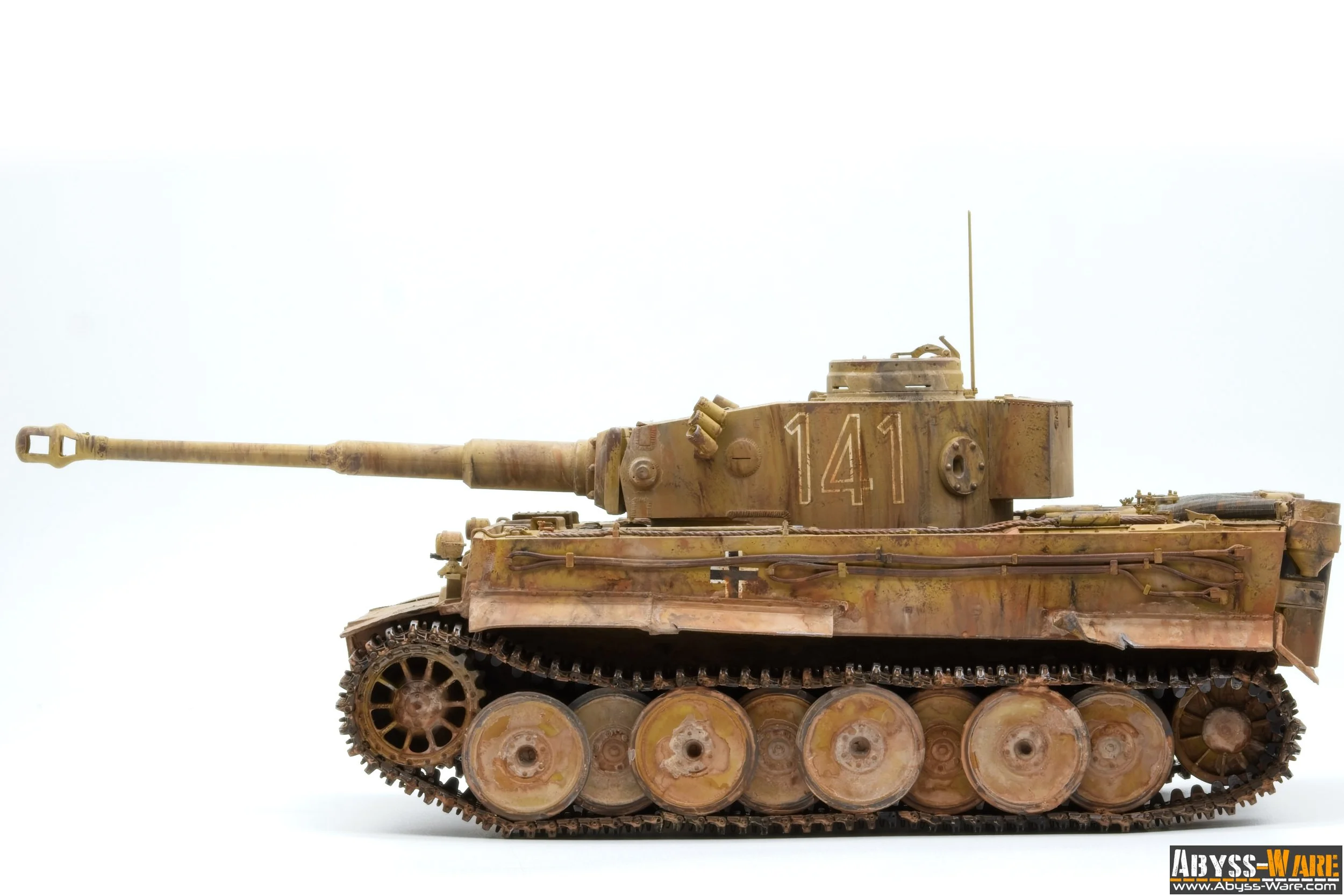 Model of a military tank with a long barrel, rusty and weathered appearance, number 141 on the side, against a plain white background.