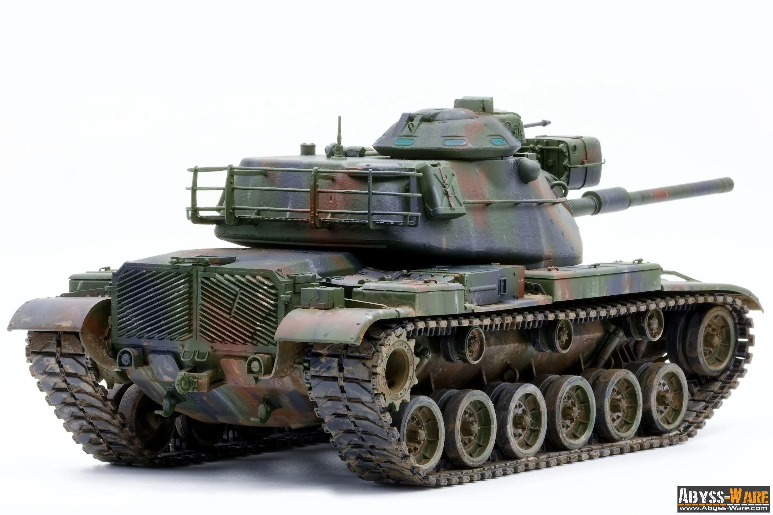 A detailed model of a military tank with camouflage paint, tracks, and turret, isolated on a white background.