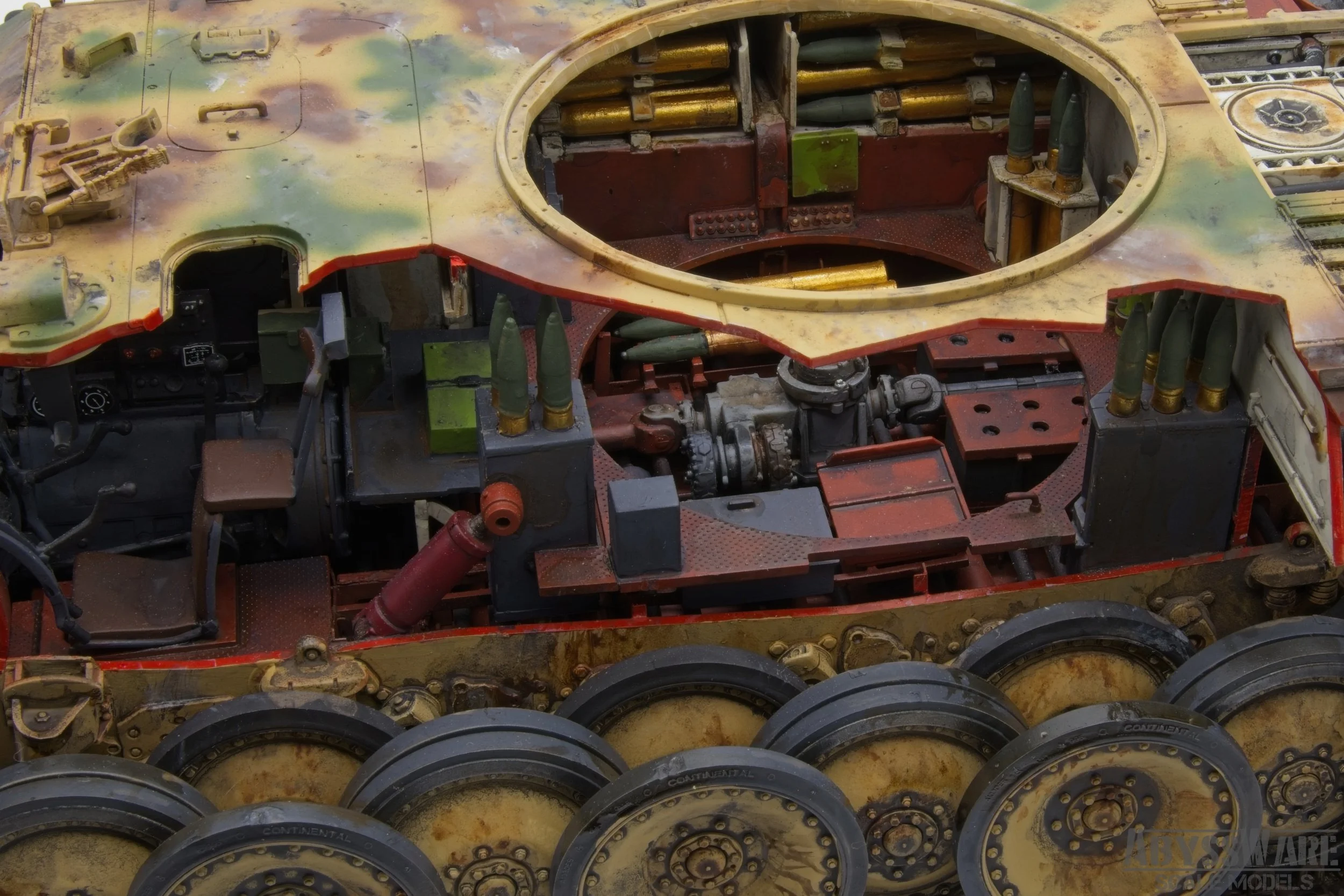 Close-up of a tank's interior and exterior components, including the treads, tracks, and internal mechanical parts.