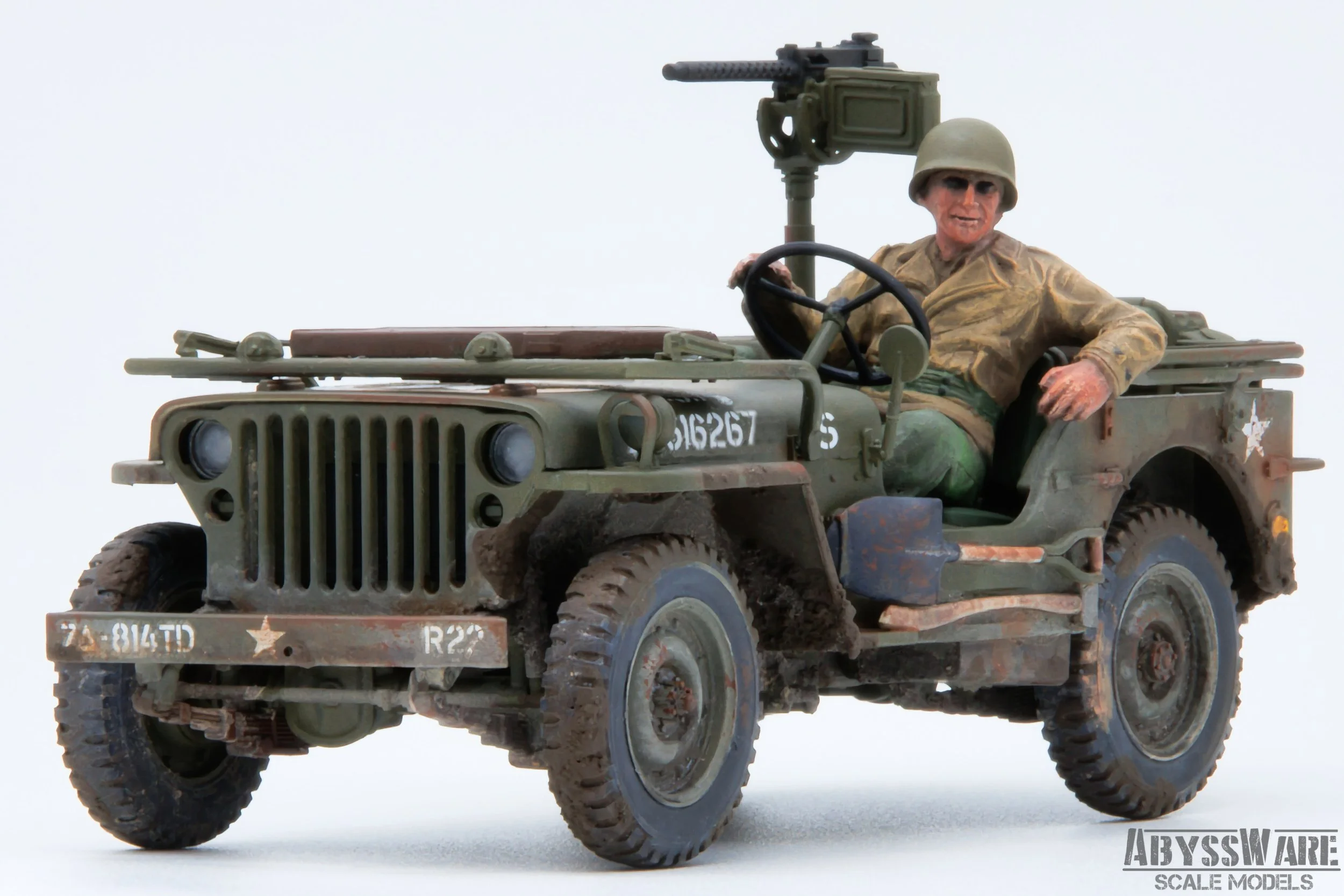 Model of a World War II military jeep with a soldier figure seated inside, wearing a helmet and military uniform, with a mounted machine gun on the vehicle's back, against a plain white background.