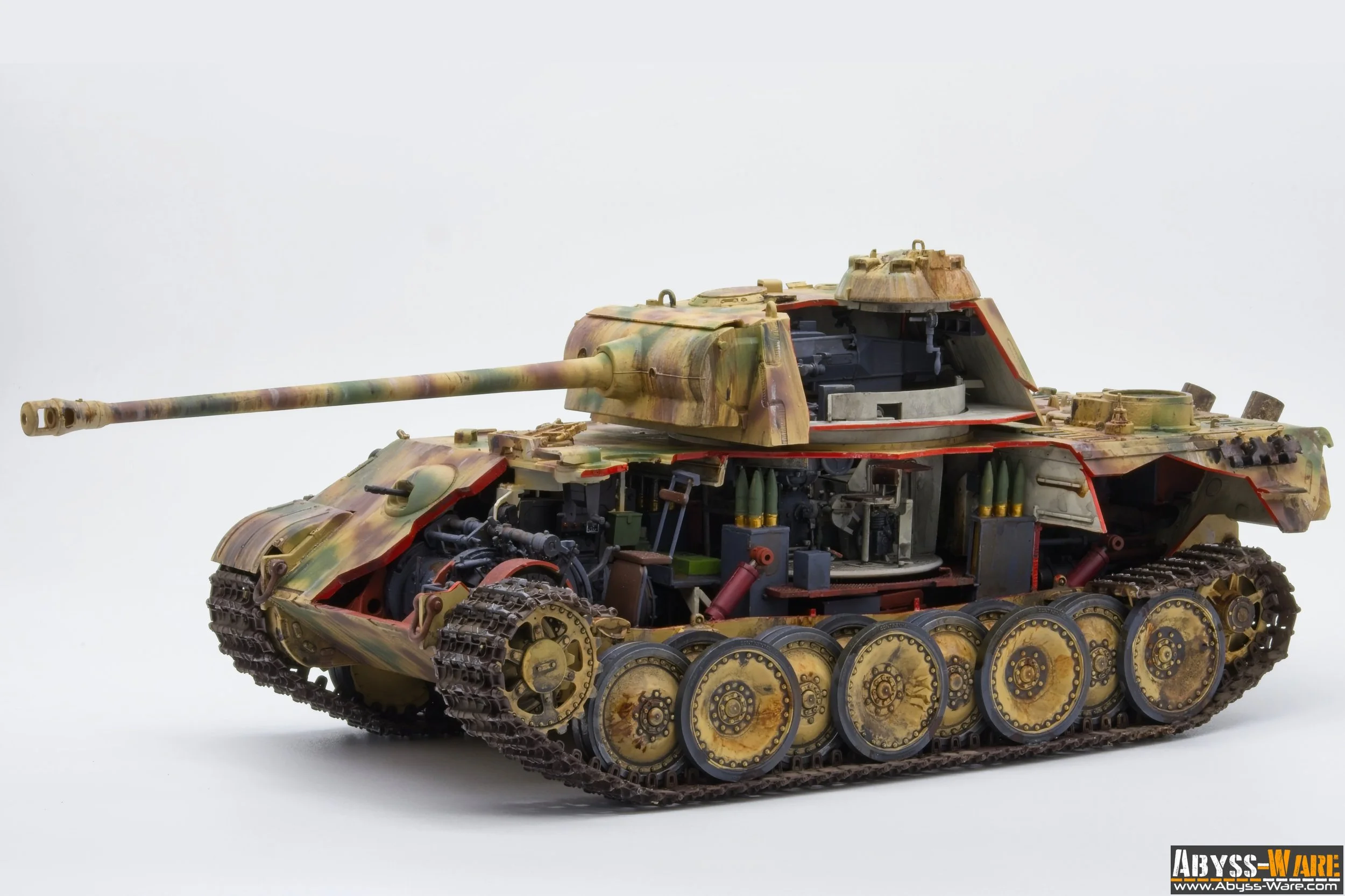 Model of a military tank with camouflage paint, showing detailed tracks, turret, and internal components, displayed against a white background.