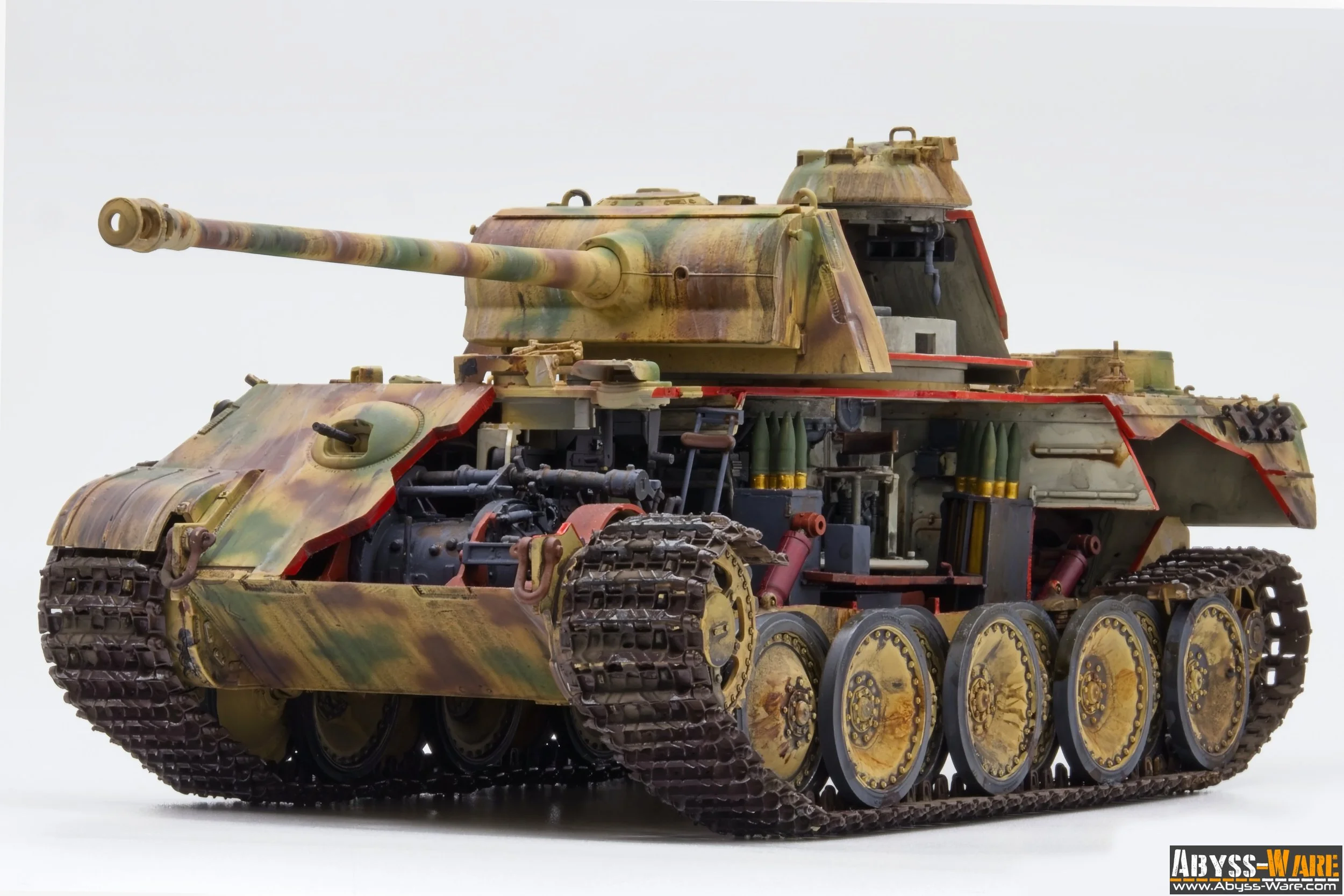 A detailed model of a military tank painted in camouflage colors, showing intricate mechanical parts and tracks, against a plain white background.