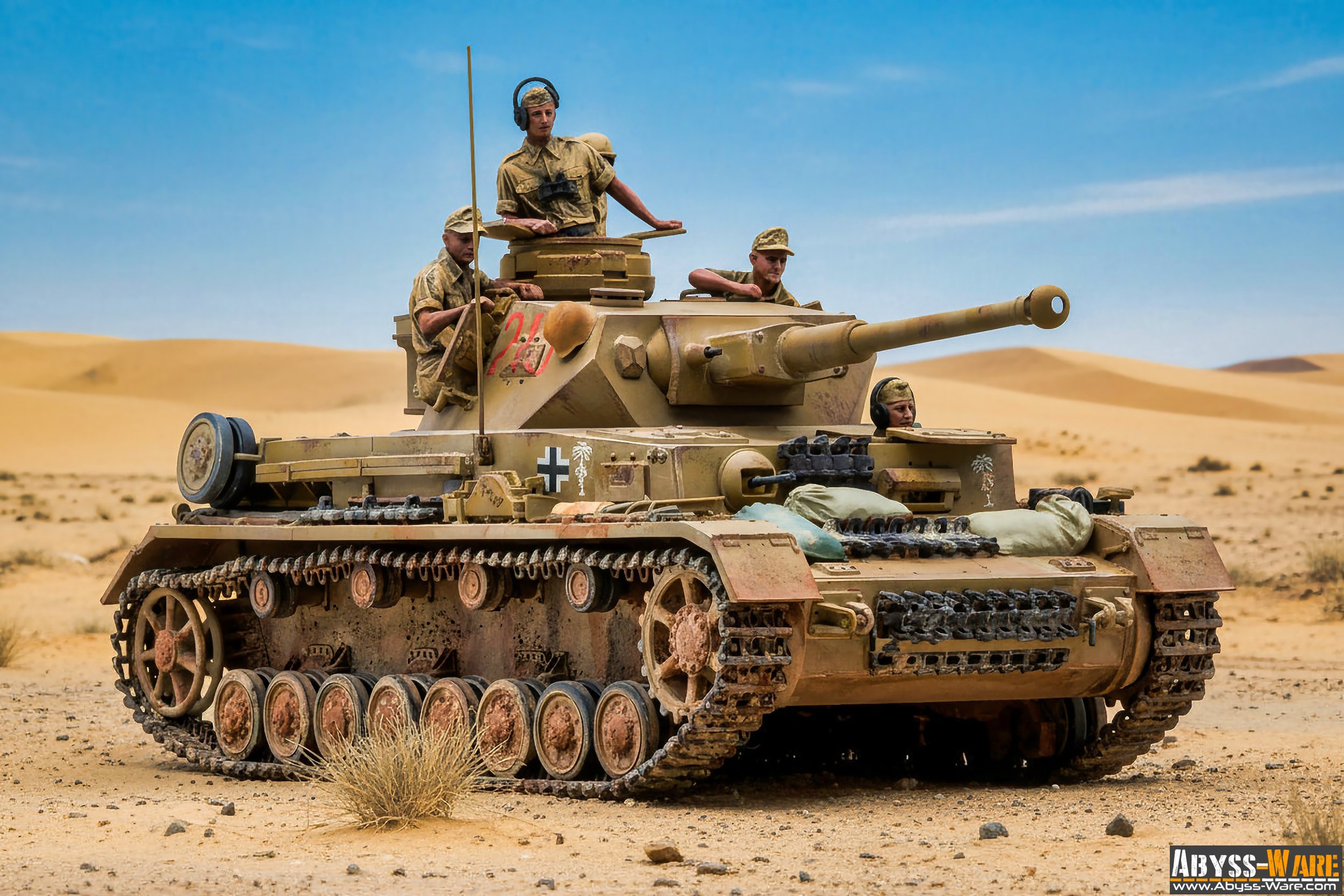 A military tank with four soldiers in desert terrain under a blue sky.
