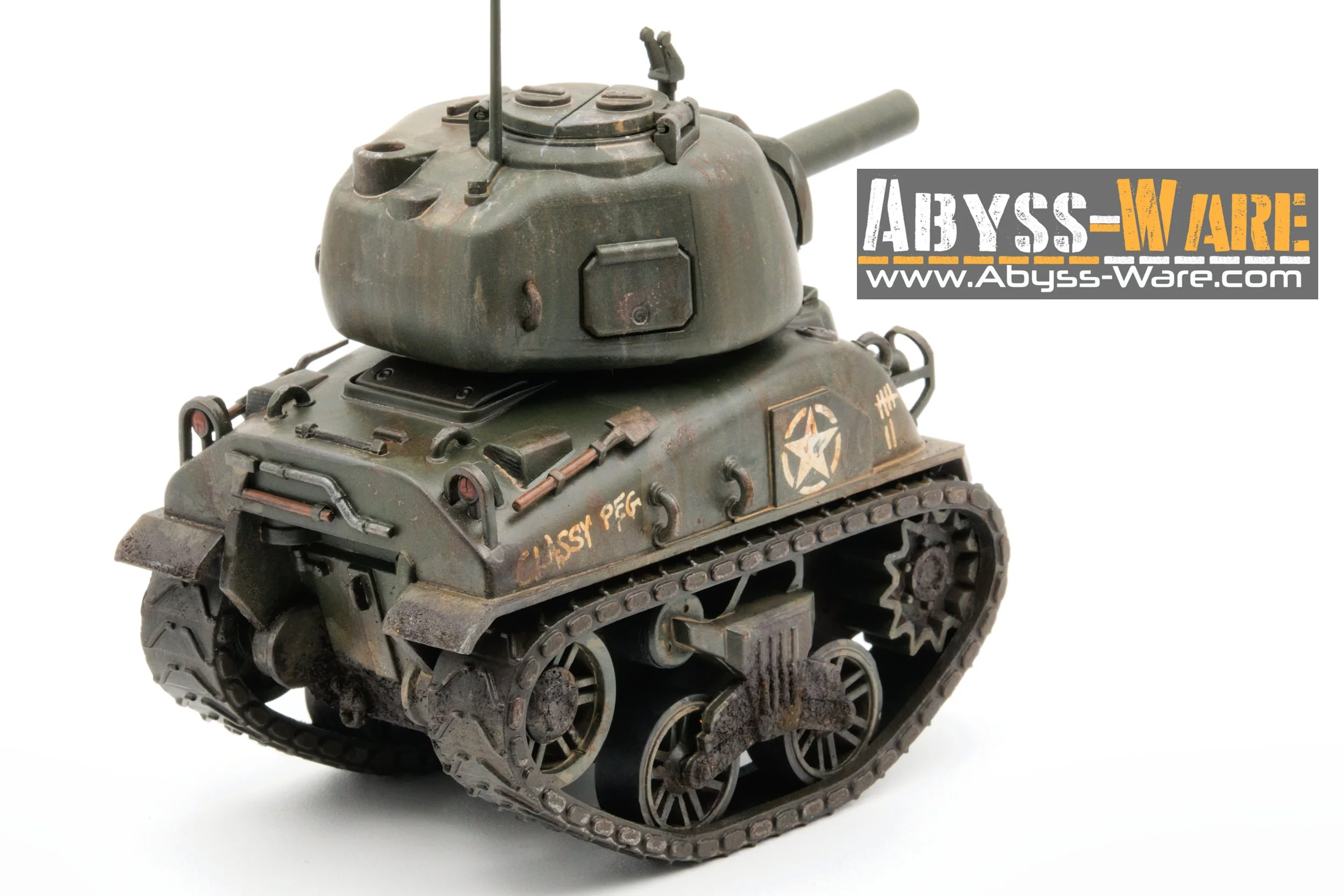 A detailed scale model of a military tank with a weathered green finish, tracks, and turret, with a label for Abyss-Ware and website URL.