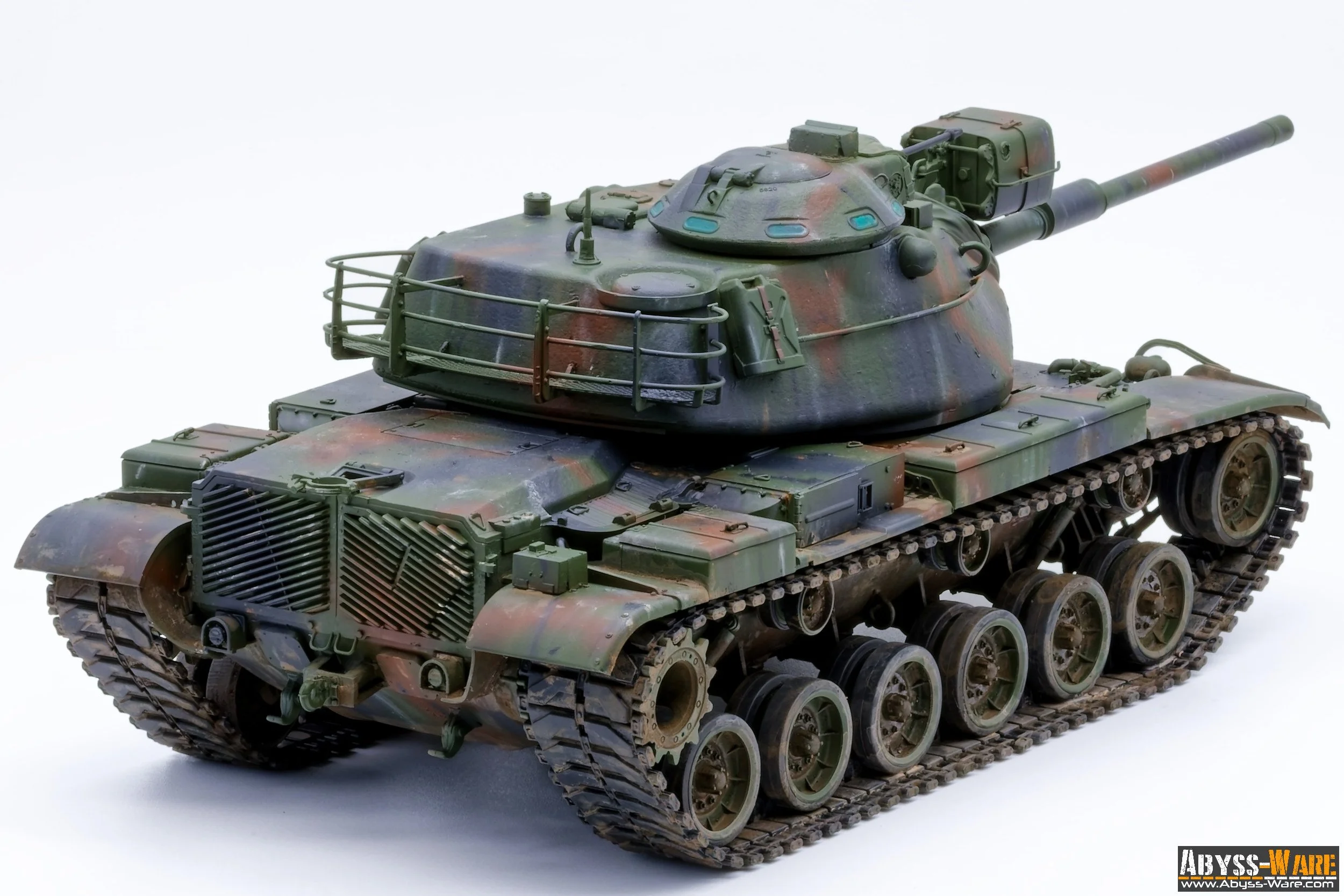 Model of a military tank with camouflage paint, detailed tracks, and turret, displayed on a white background.