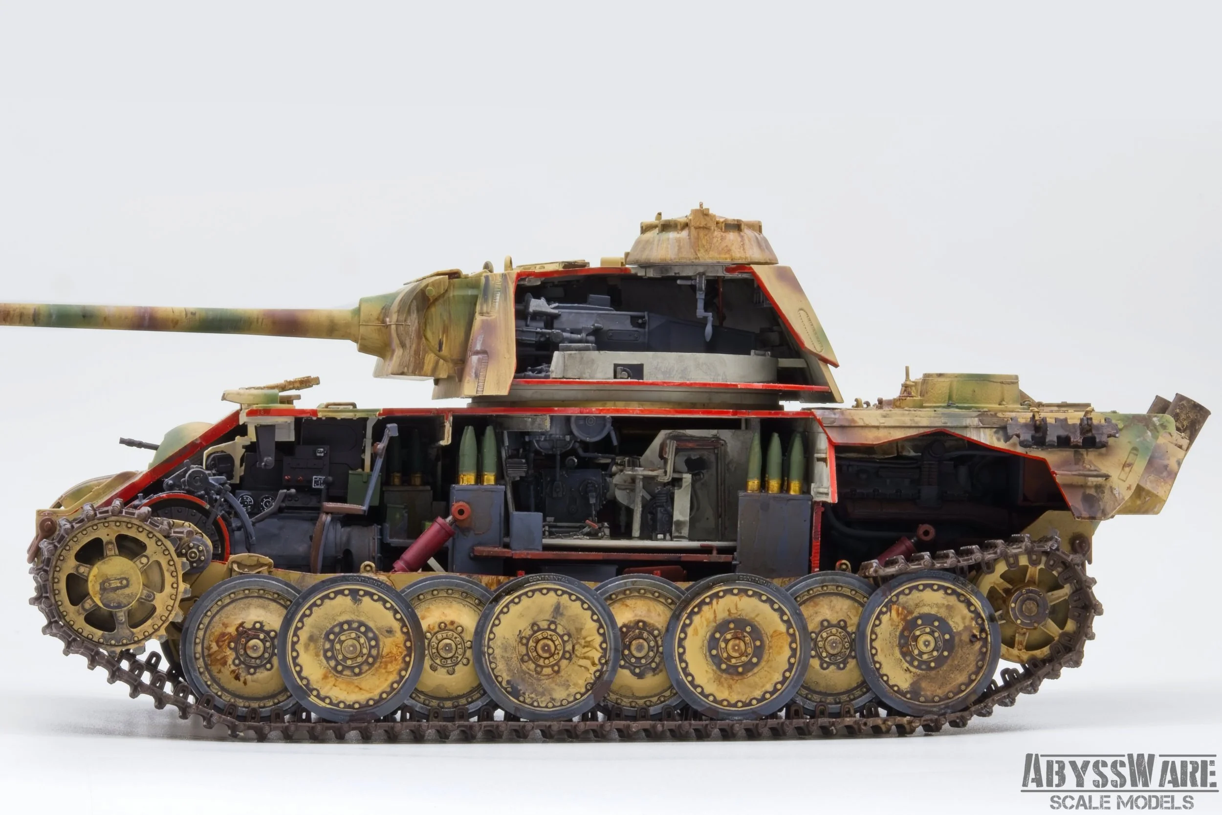 A detailed scaled model of a military tank with an exposed internal structure, displaying the tracks, wheels, and internal components.