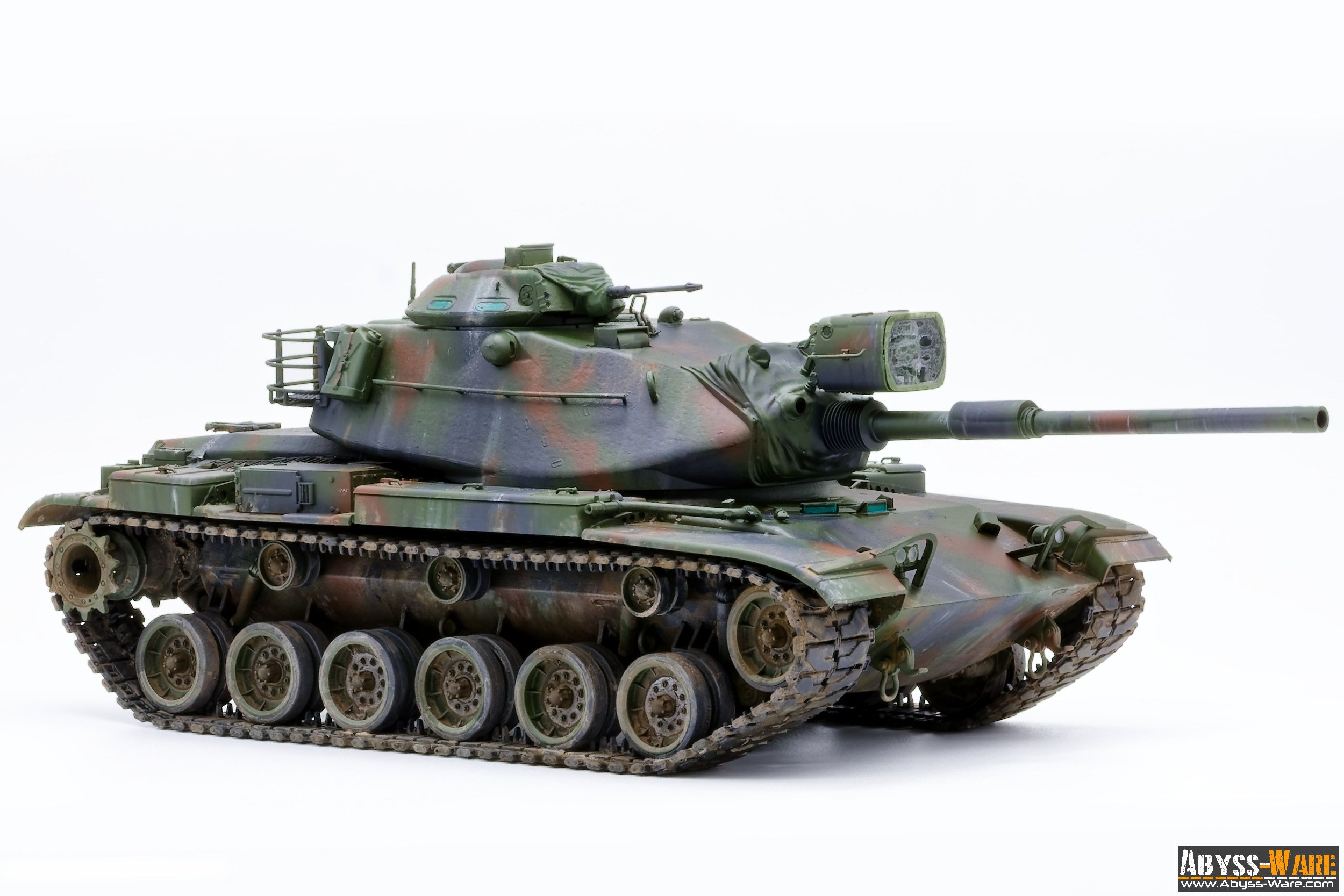 Model of a military tank with green and brown camouflage pattern, displayed against a plain white background.