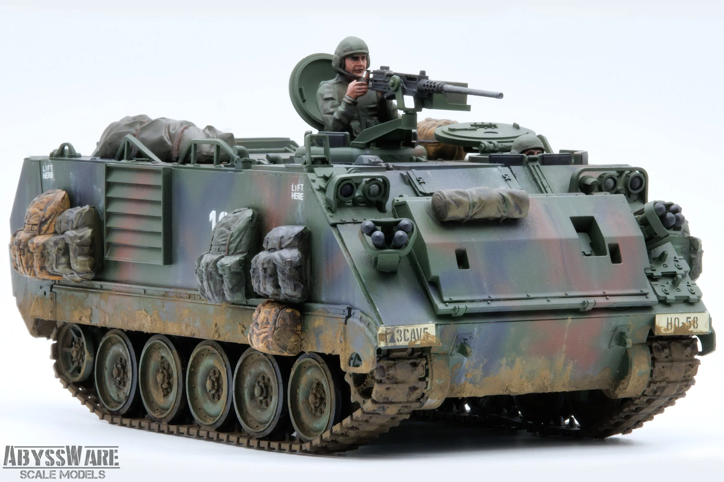 Scale model of a military armored personnel carrier with soldiers inside, painted in camouflage, marked with 'AbyssWare Scale Models' branding.