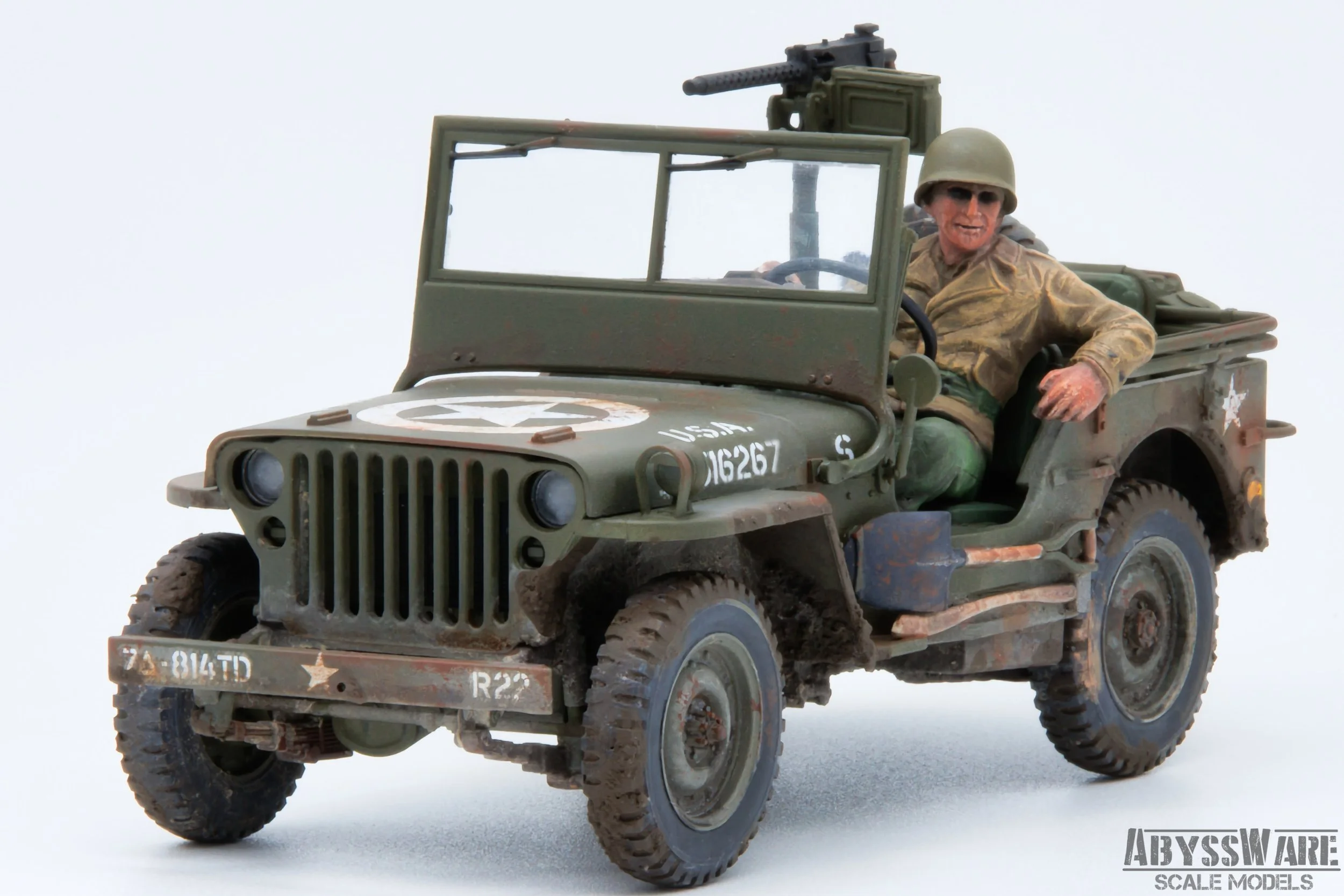 Model of a World War II military jeep with a soldier figure in the driver's seat