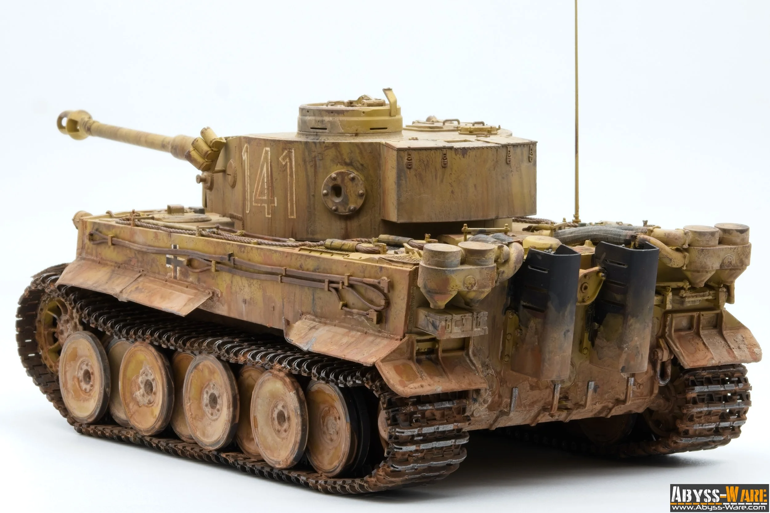 A detailed model of a military tank with weathered tan and brown paint, large gun barrel, and tracked wheels, positioned against a plain white background.