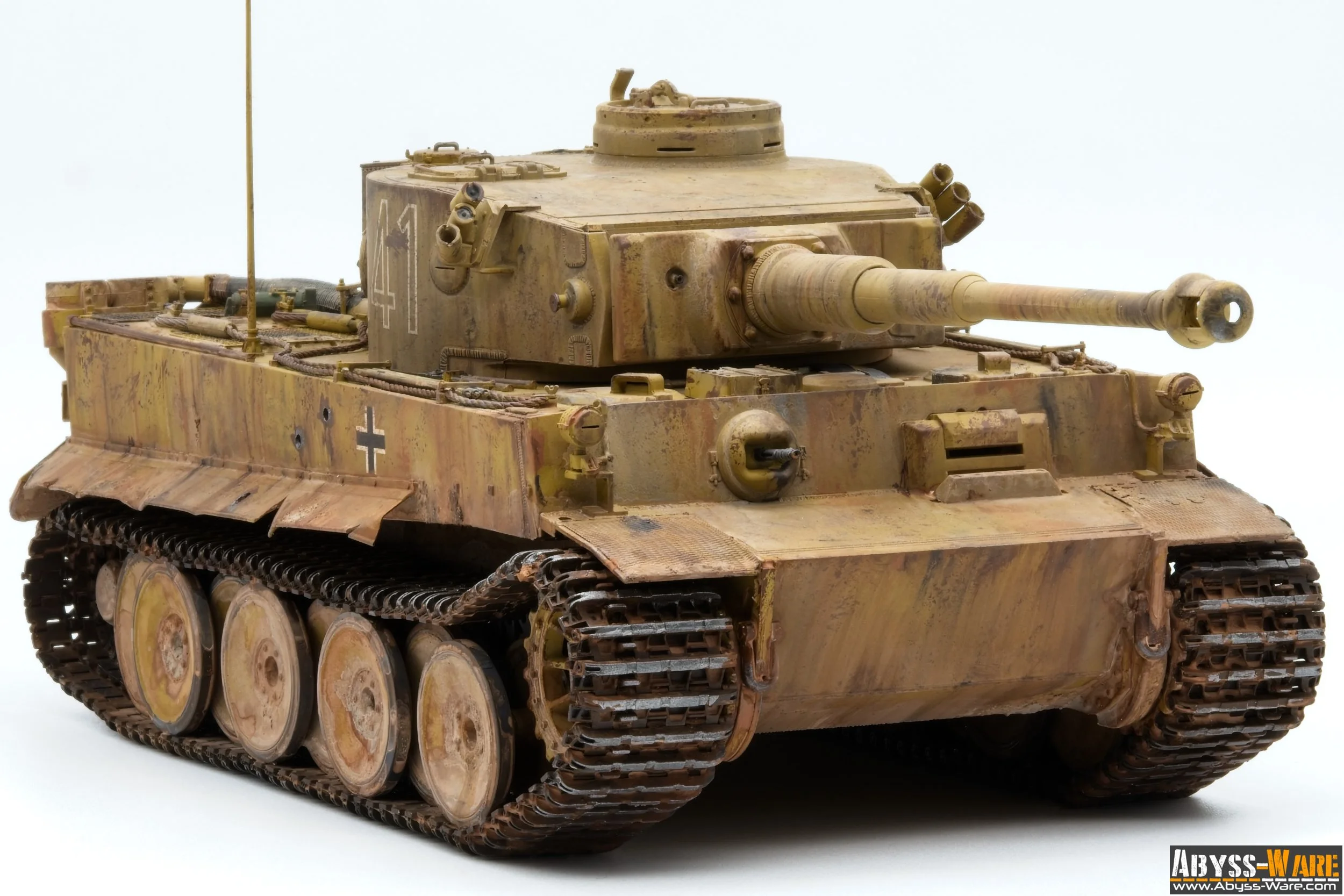 Model of a military tank in desert camouflage with German symbols and markings, set against a white background.