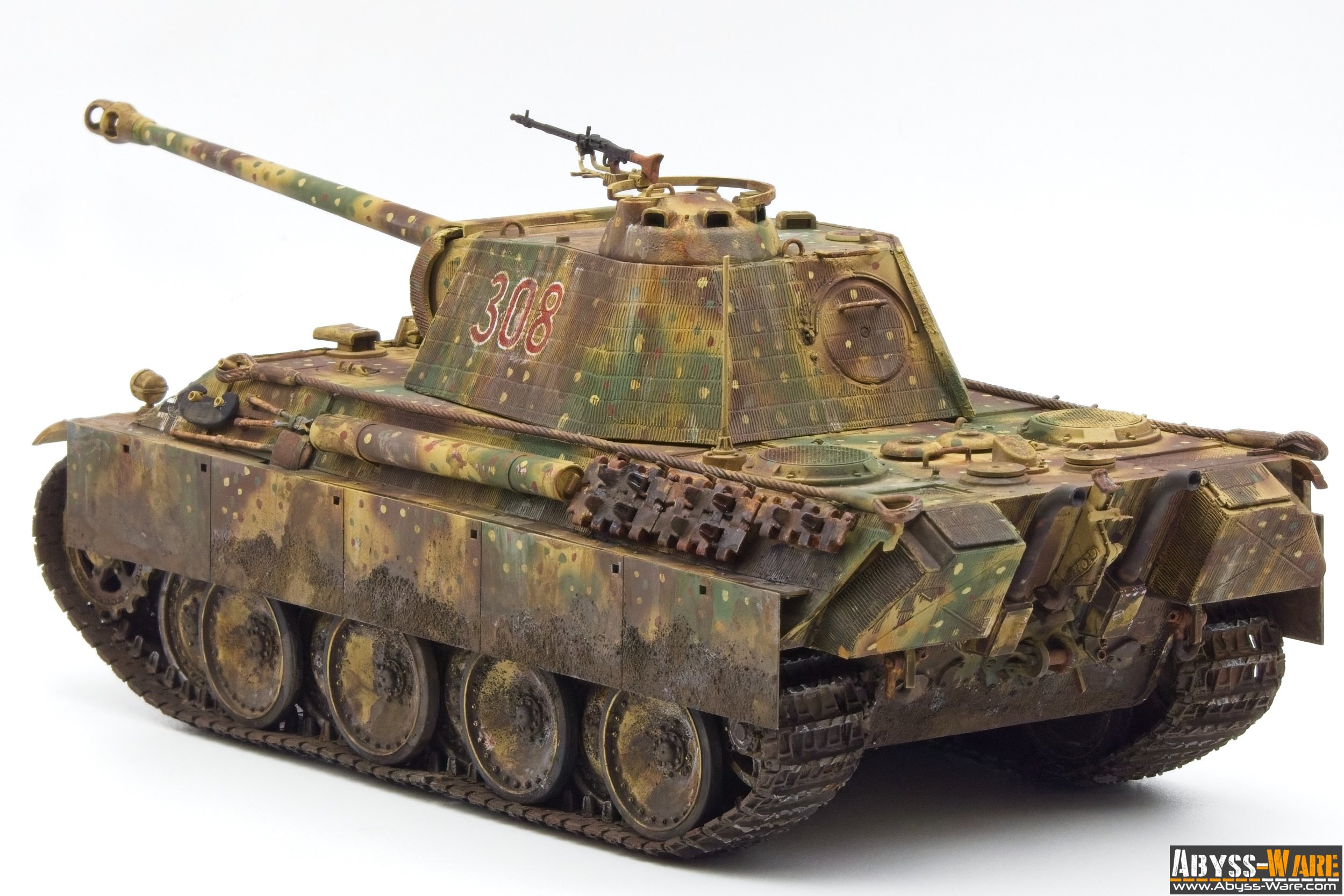 Model of a military tank with camouflage paint, the number 308 on its turret, and a mounted machine gun.
