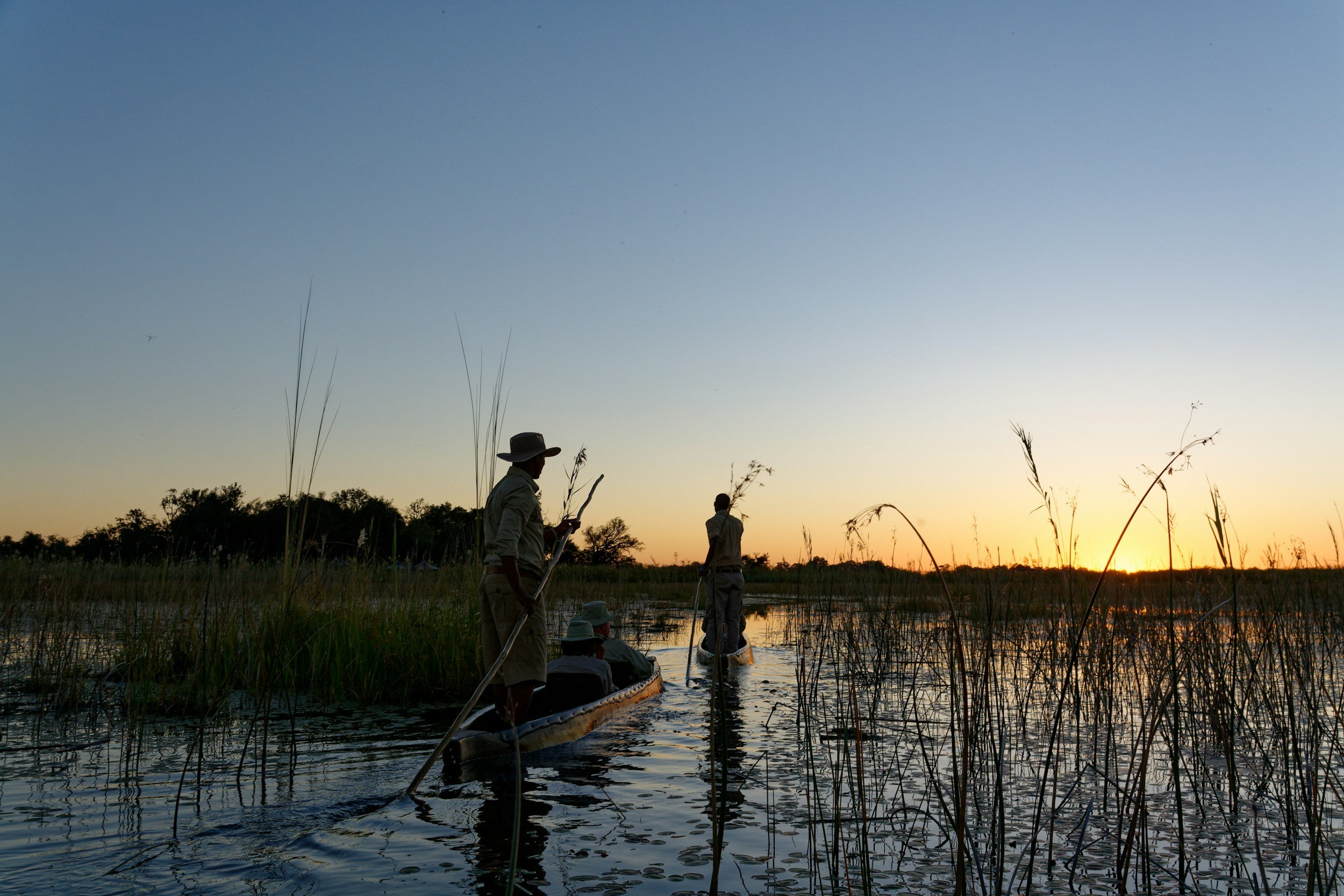 mokoro at sunset botswana