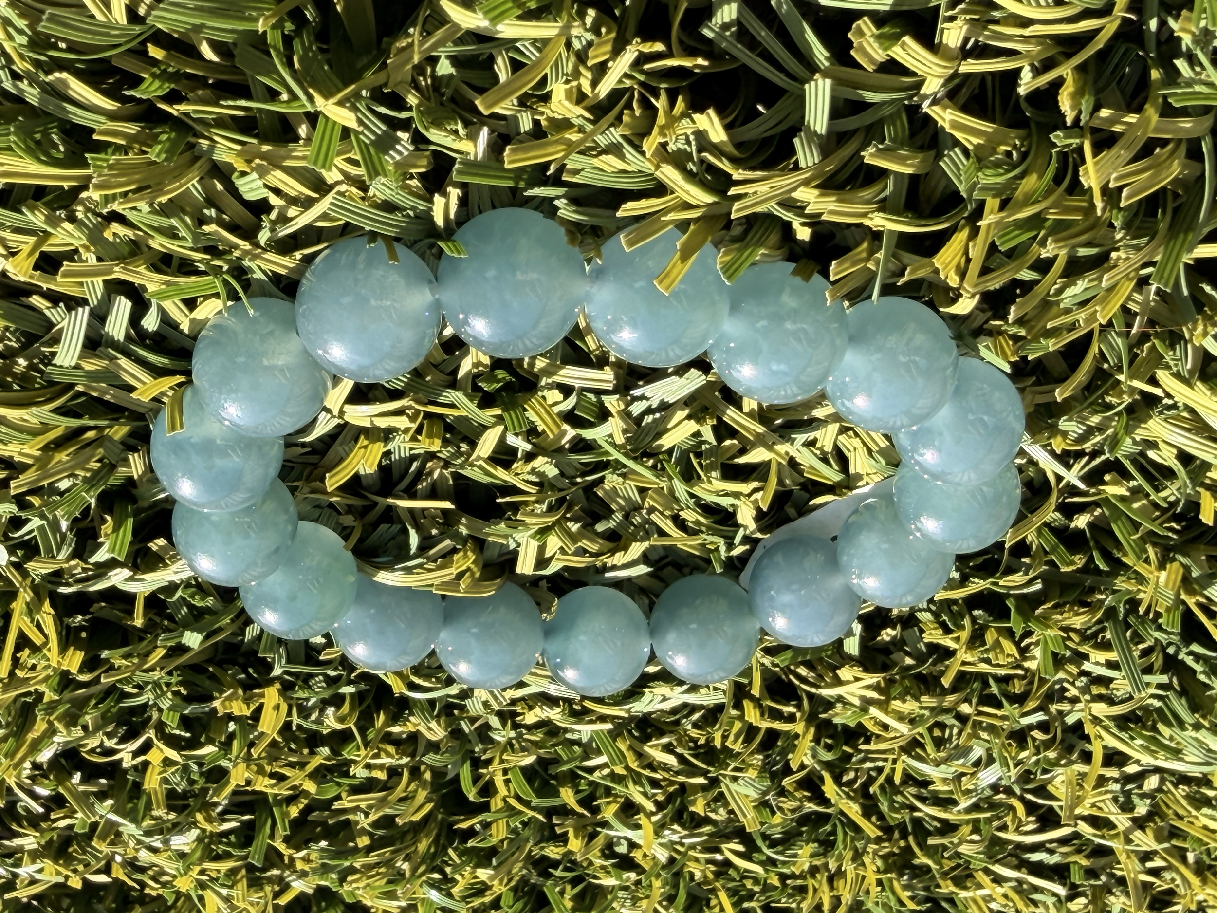 Beautiful blue water type A Jadeite Jade 12.5mm large bead bracelet.  Clear and translucent and glowy