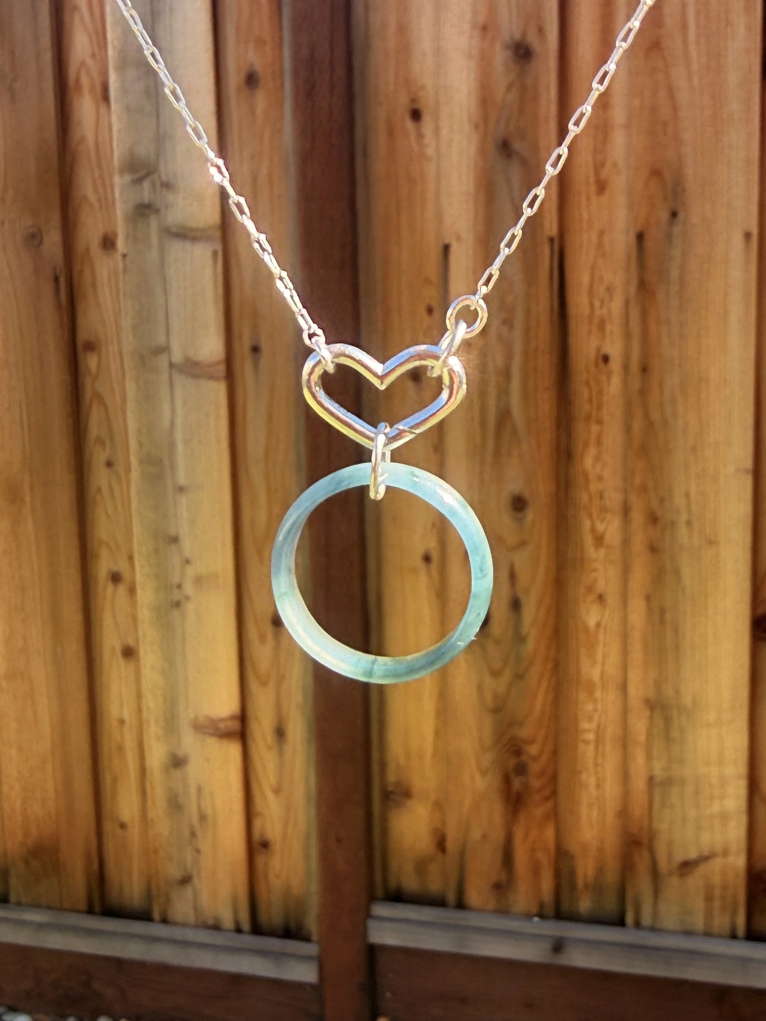 Silver Heart chain necklace with a translucent glowing Type A Jadeite Jade pendant