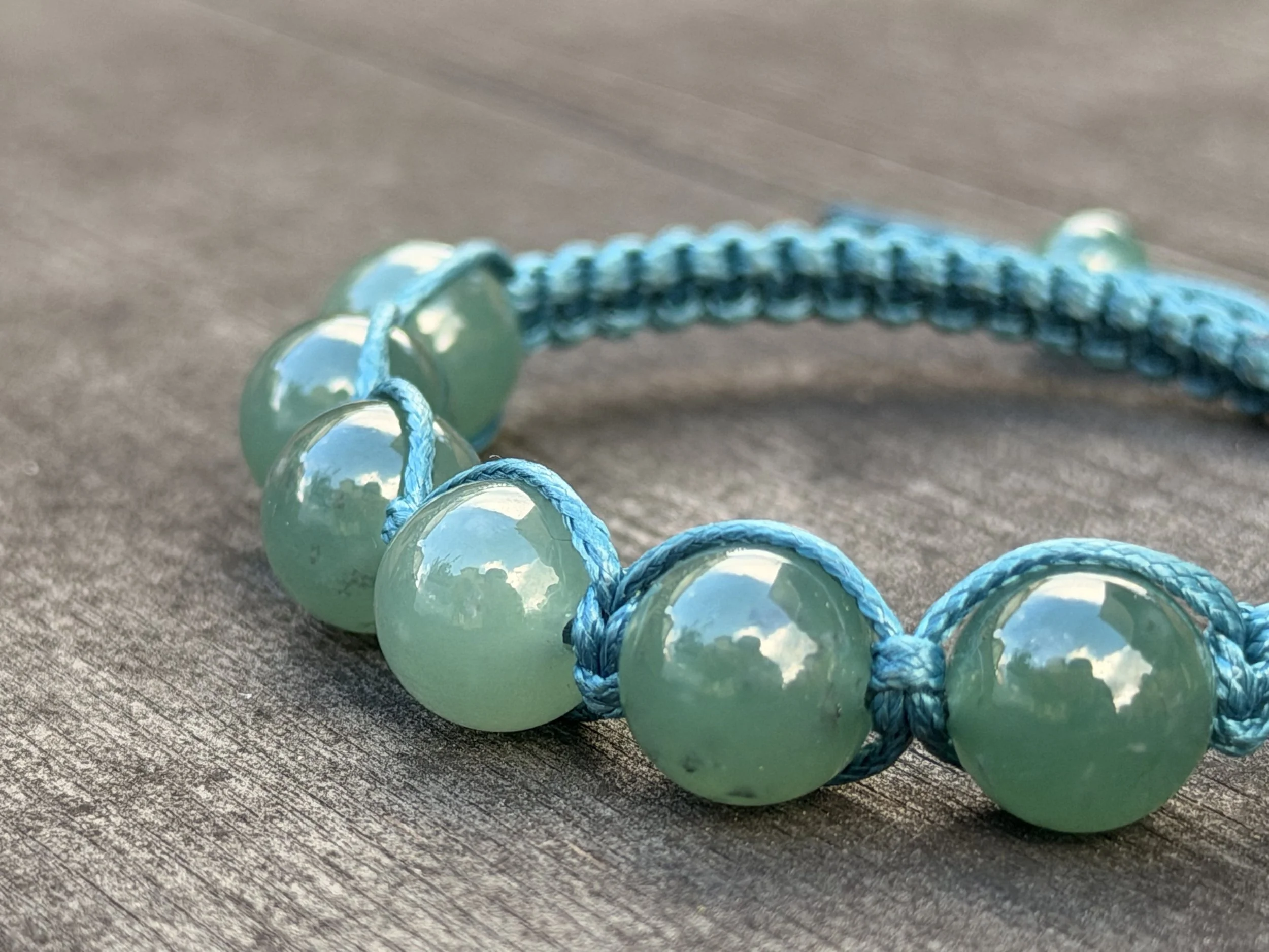 Macro detail of translucent blue jadeite stone showing natural internal structure, untreated Type A jade from Guatemala