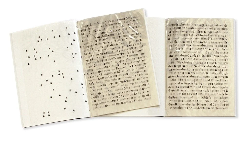  Open view showing the volume “Alpha” (the first page is turned with all of the A/a letters) and the volume “Beta” (because of the transparency of the 40 g/qm cellophane pages, the entire text can only be read on the first page). If both volumes are 