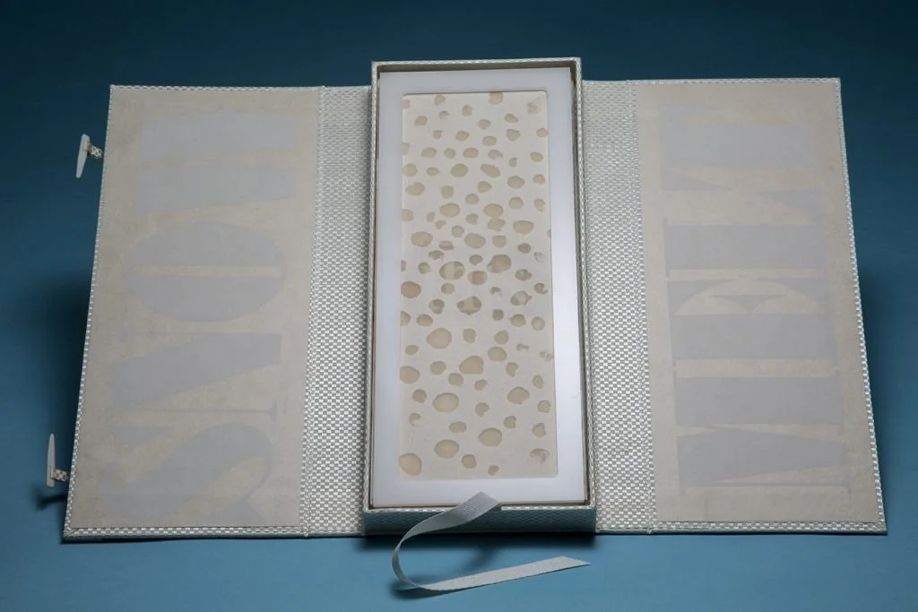  box open, front cover of book 