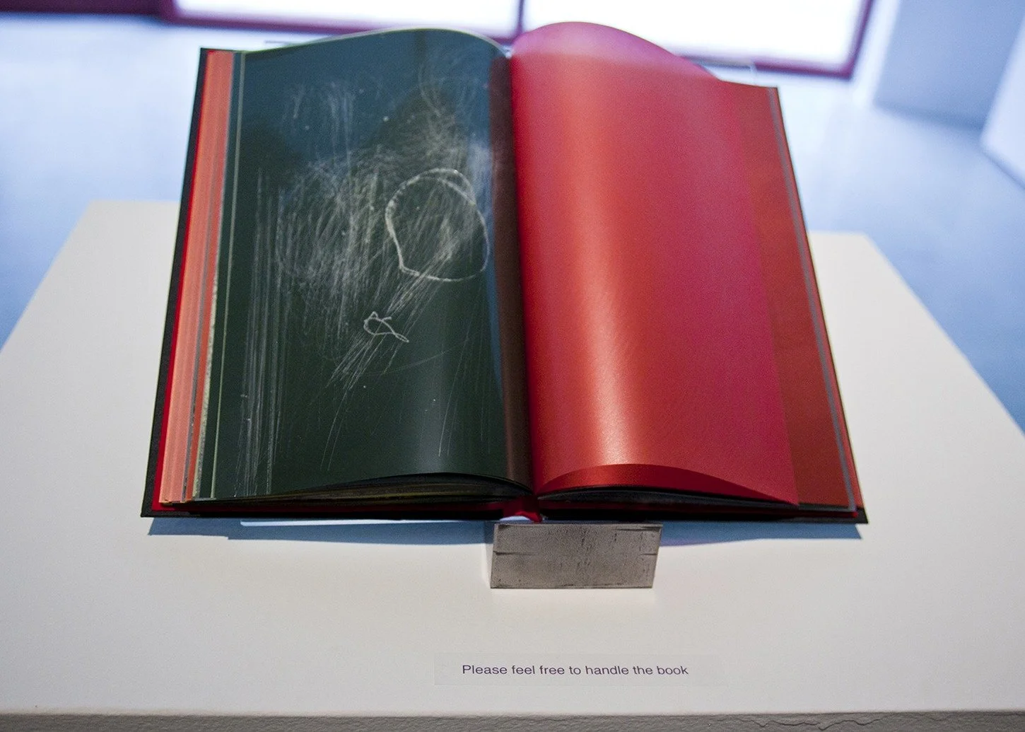  Installation shot of the book in exhibition setting; the book is meant to be handled by the visitors. 