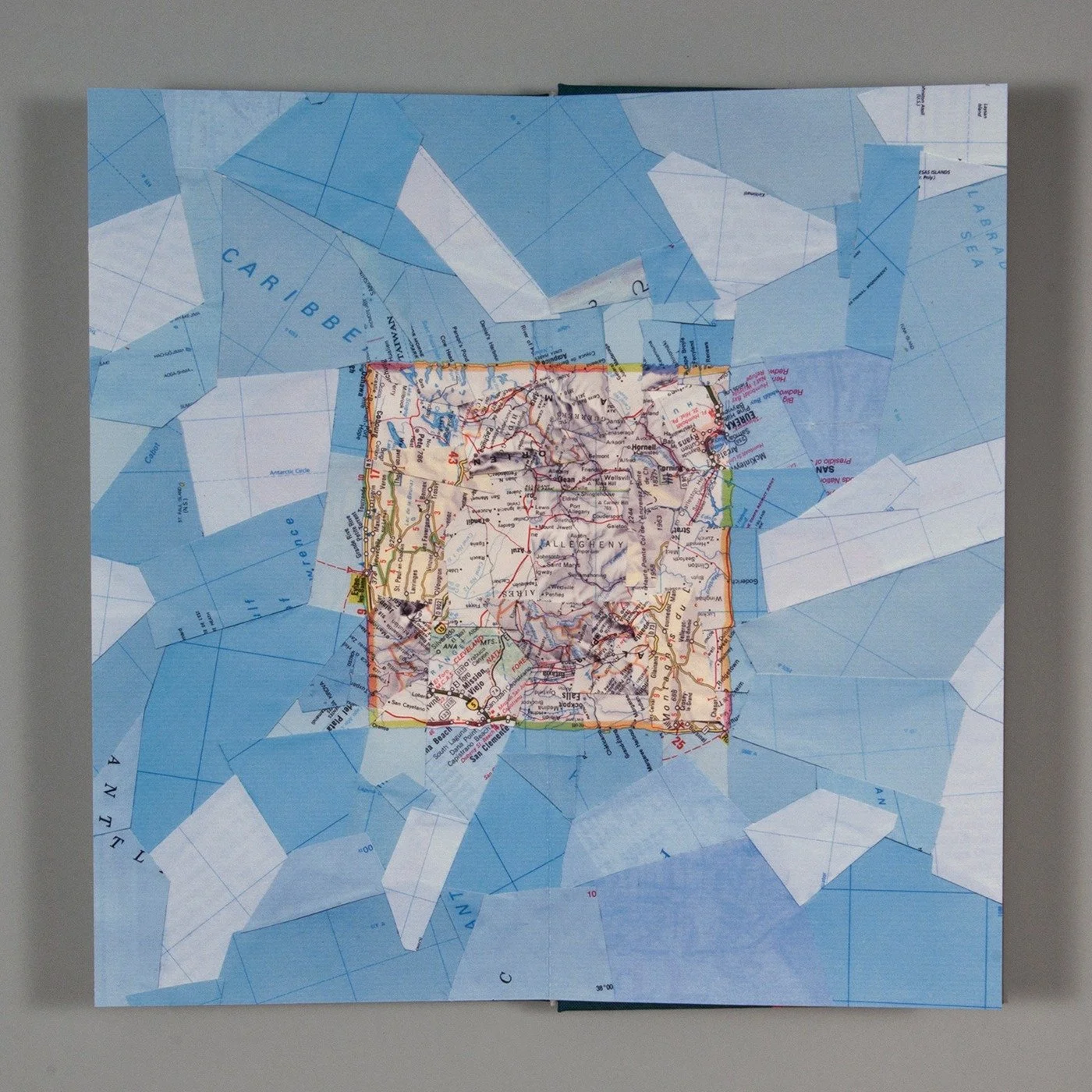  First (or last) image page spread, showing a square ‘island’ map collage. The book ends with an inverse of this image, a square ‘pond-ocean’. 