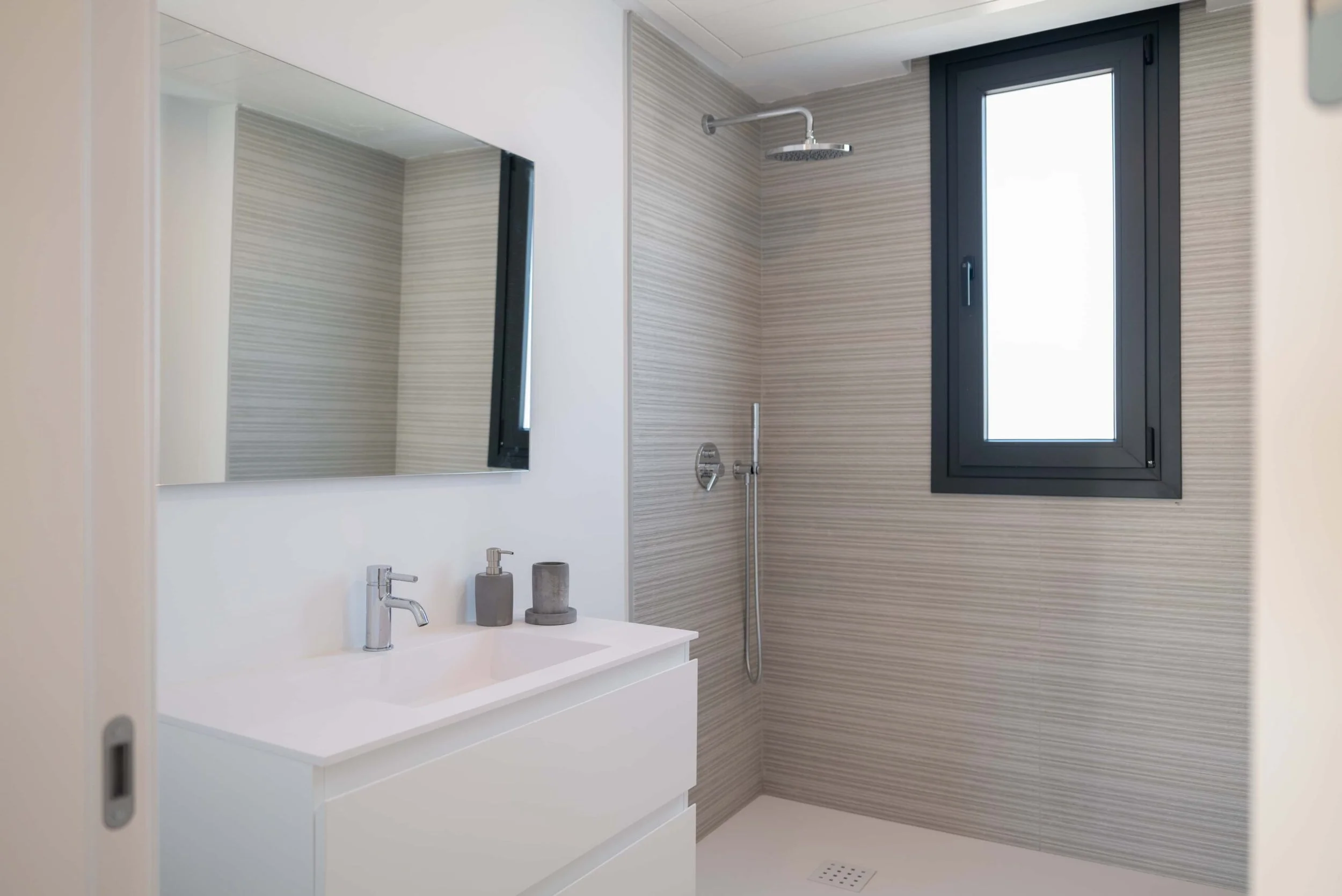 Contemporary bathroom with high-end fixtures and natural wood accents..jpg