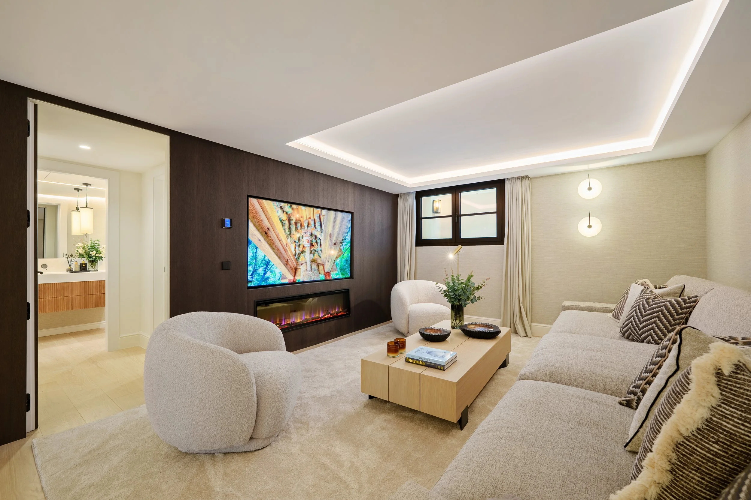 Private Cinema/Lounge: A cozy, high-tech media room with integrated shelving and a secondary fireplace for intimate evenings.