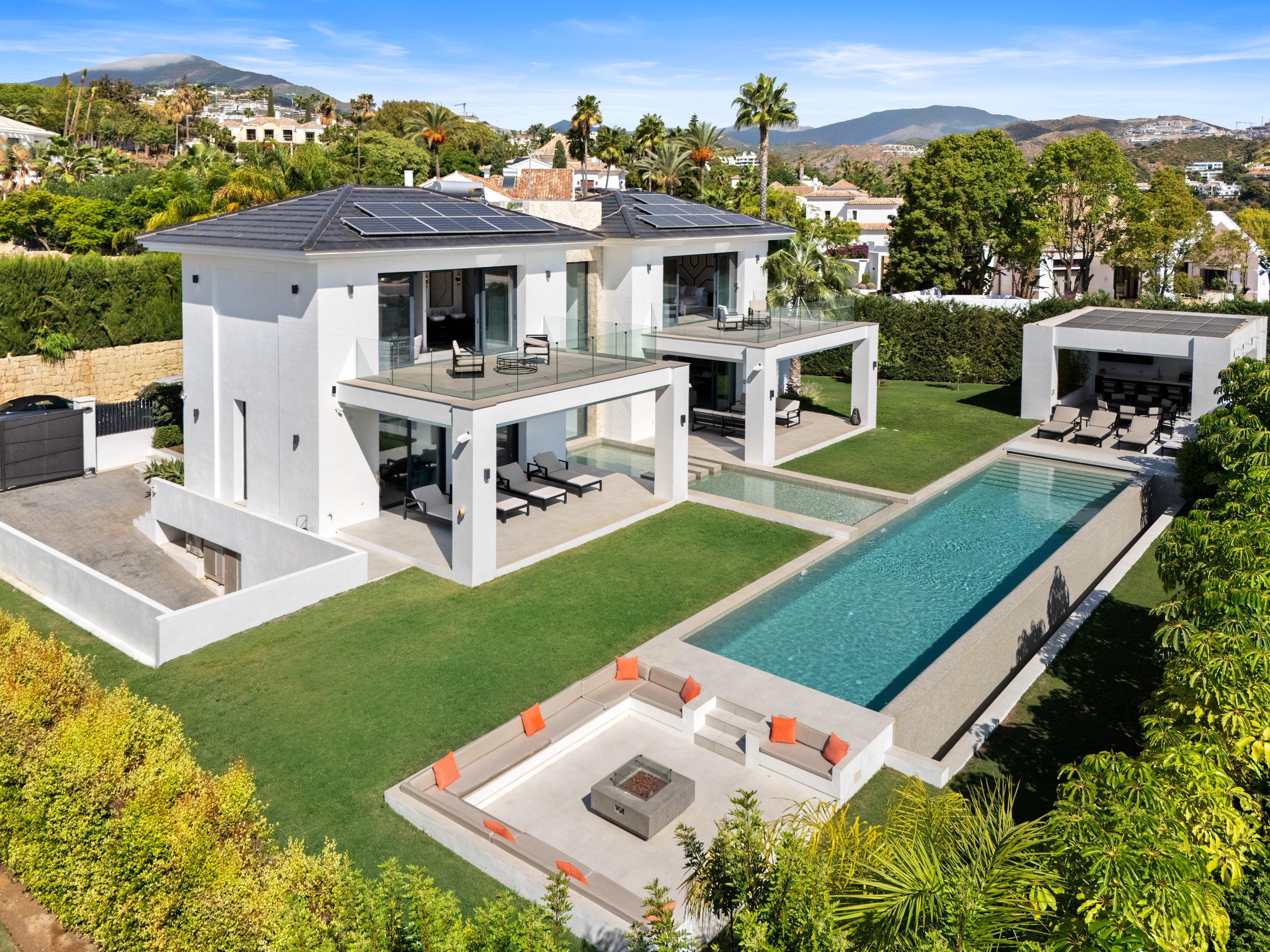 Elevated aerial shot showing the villa’s contemporary design, swimming pool, and landscaped gardens.