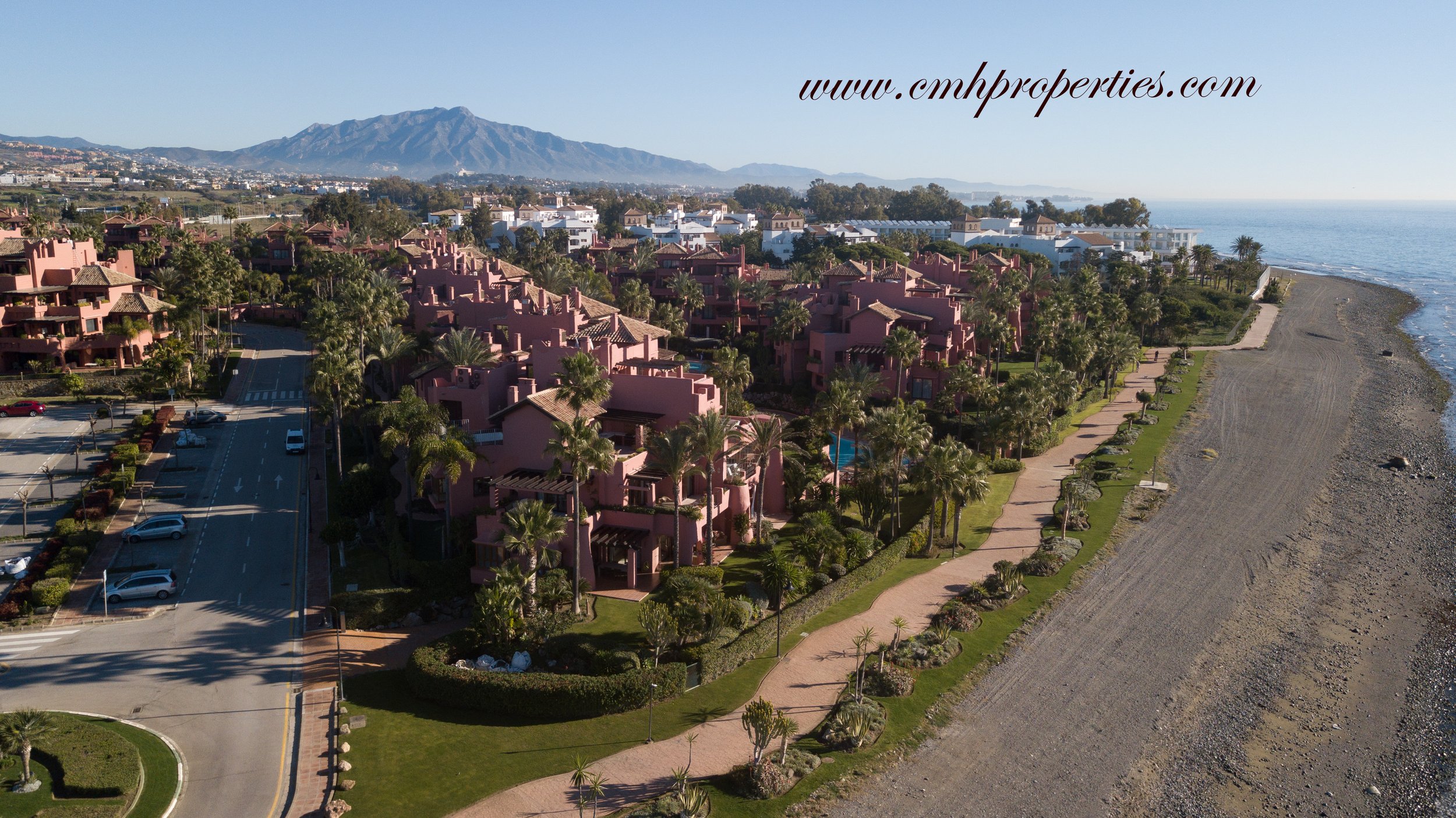 Aerial view of a luxury frontline beach complex in Estepona with direct Mediterranean access.