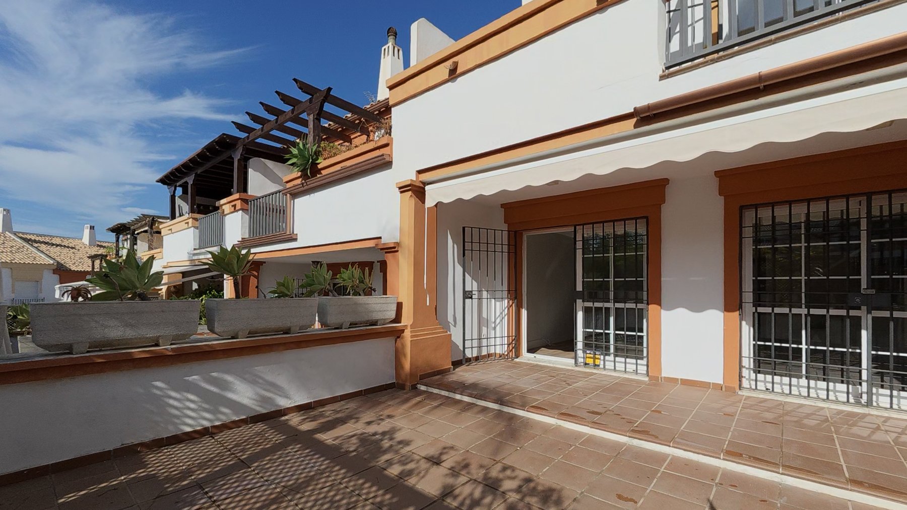Highlight the outdoor lounge area that leads directly to the pool.