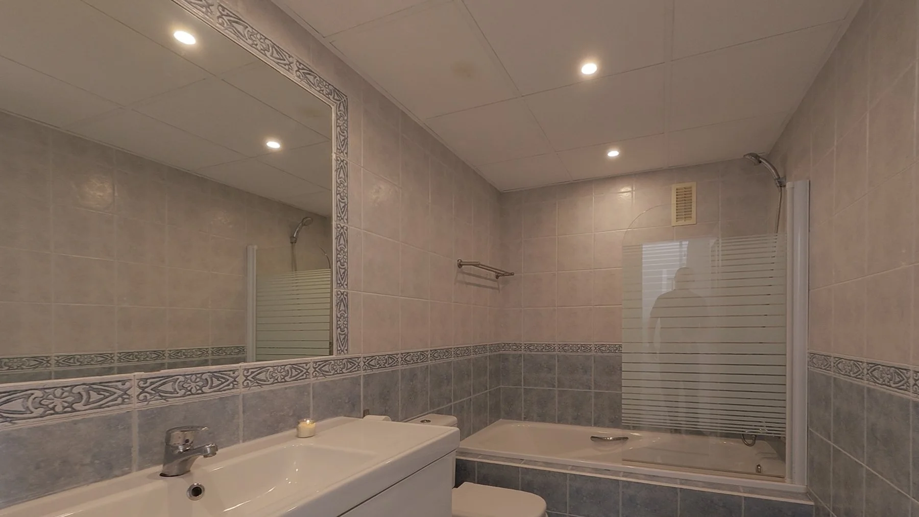 Show the luxury marble finishes and double sinks