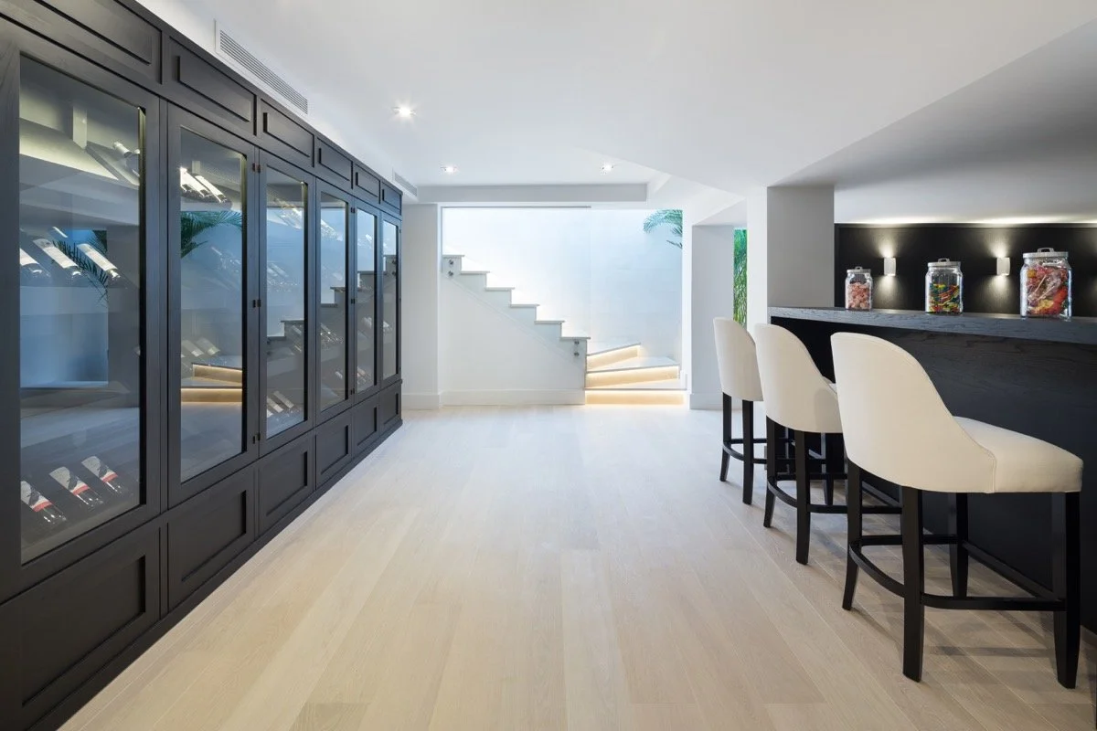 Temperature-controlled private wine cellar and bodega for luxury home entertaining.