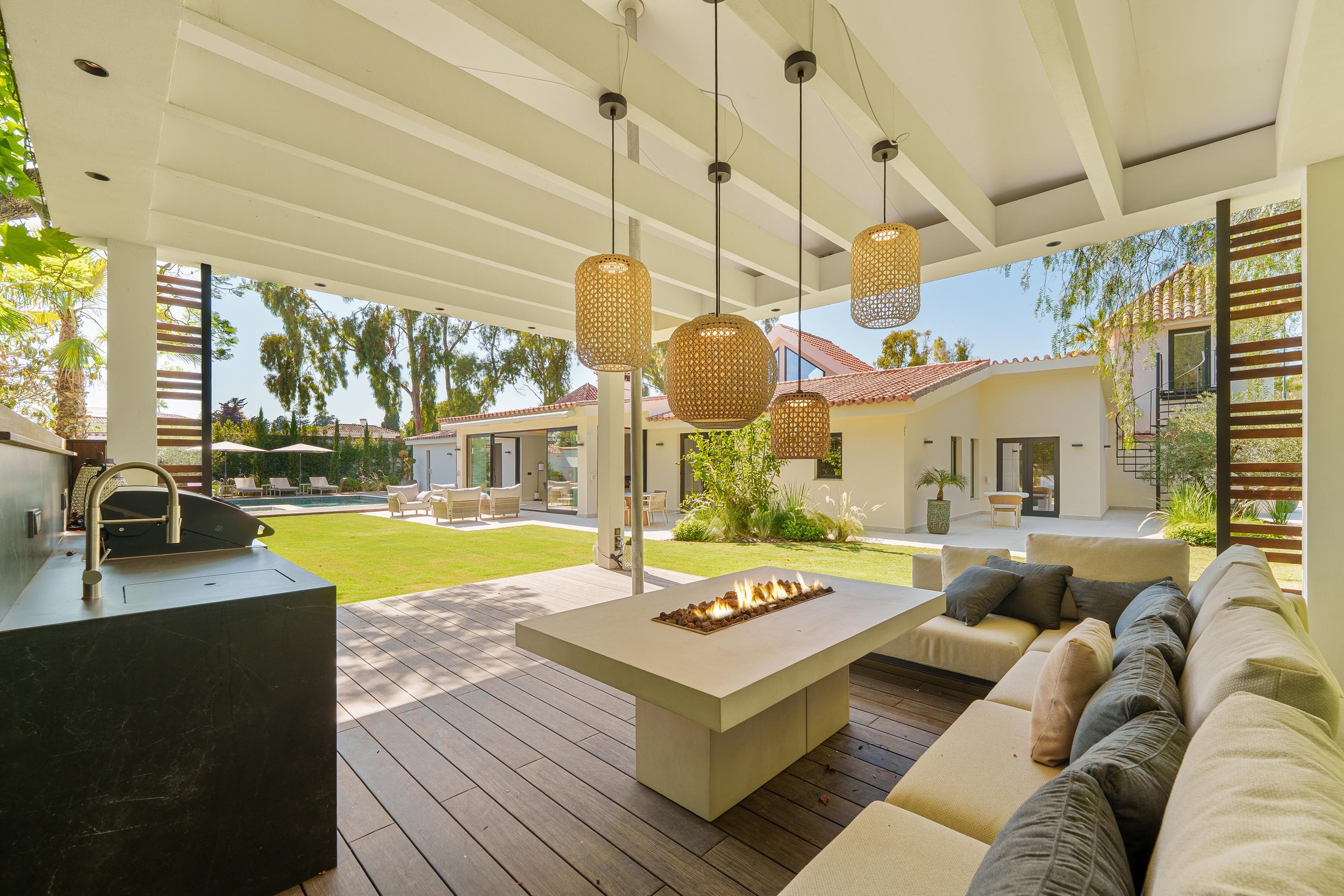 Luxury outdoor pergola lounge with stylish seating for Mediterranean outdoor living