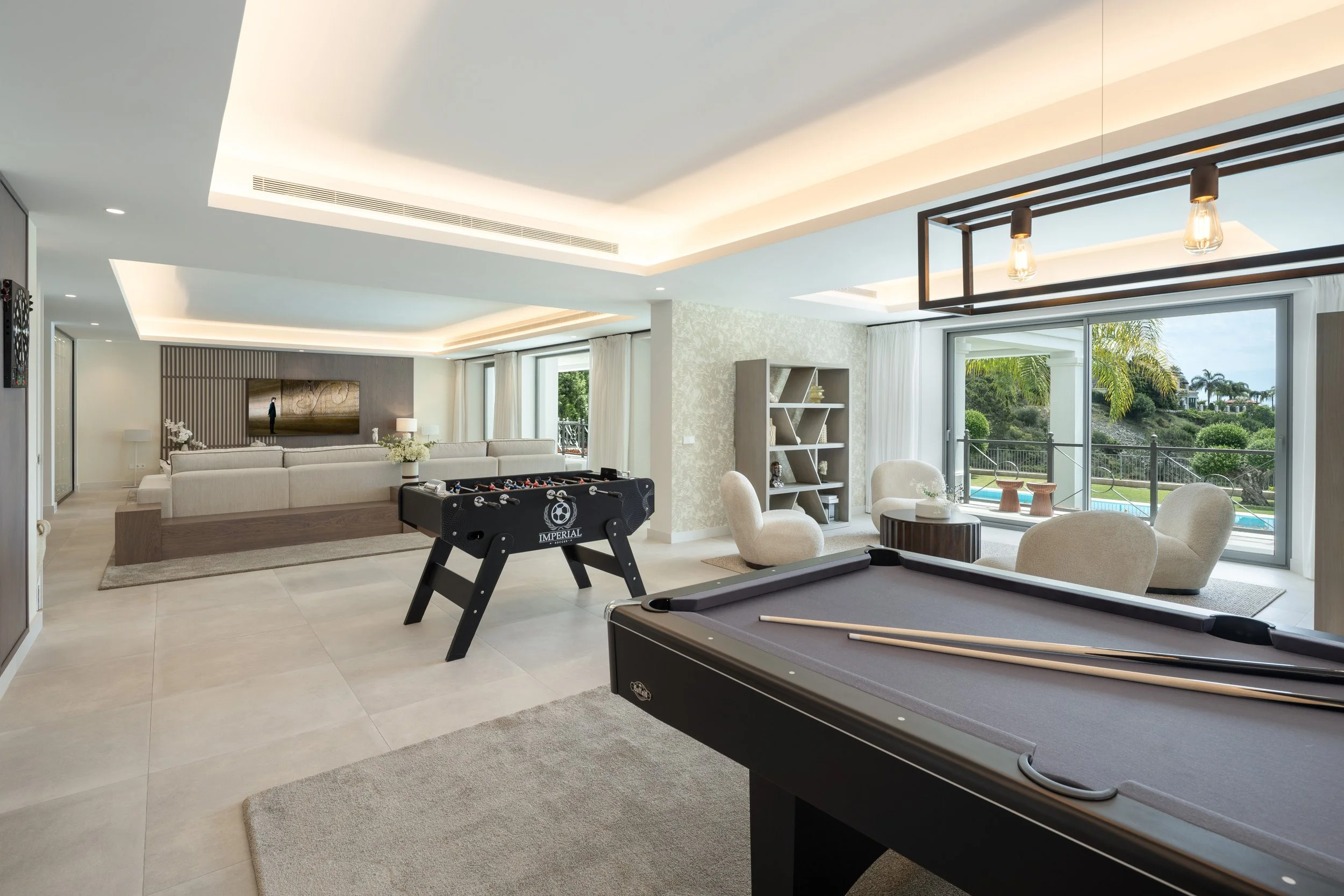 The dedicated entertainment wing featuring a professional billiards table and games area for guests