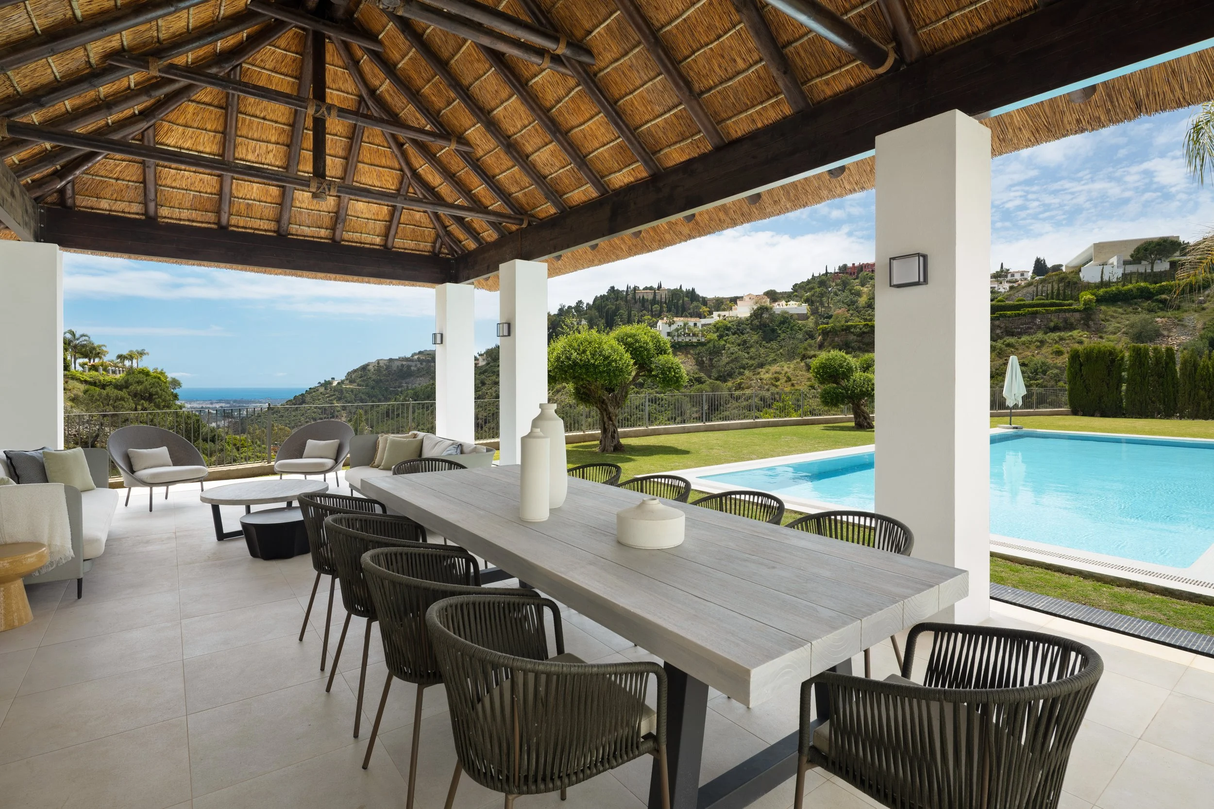 The outdoor gazebo and al fresco dining area, fully equipped with a kitchen for poolside entertaining.