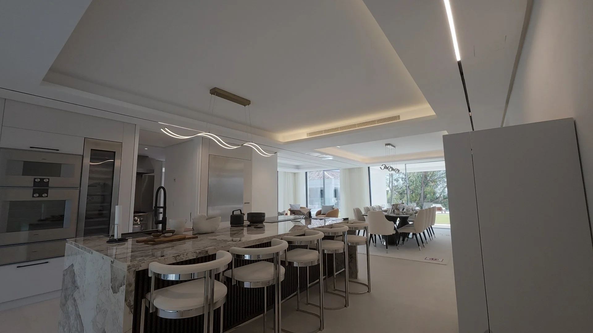 State-of-the-art gourmet kitchen with marble island and top-tier appliances..jpg