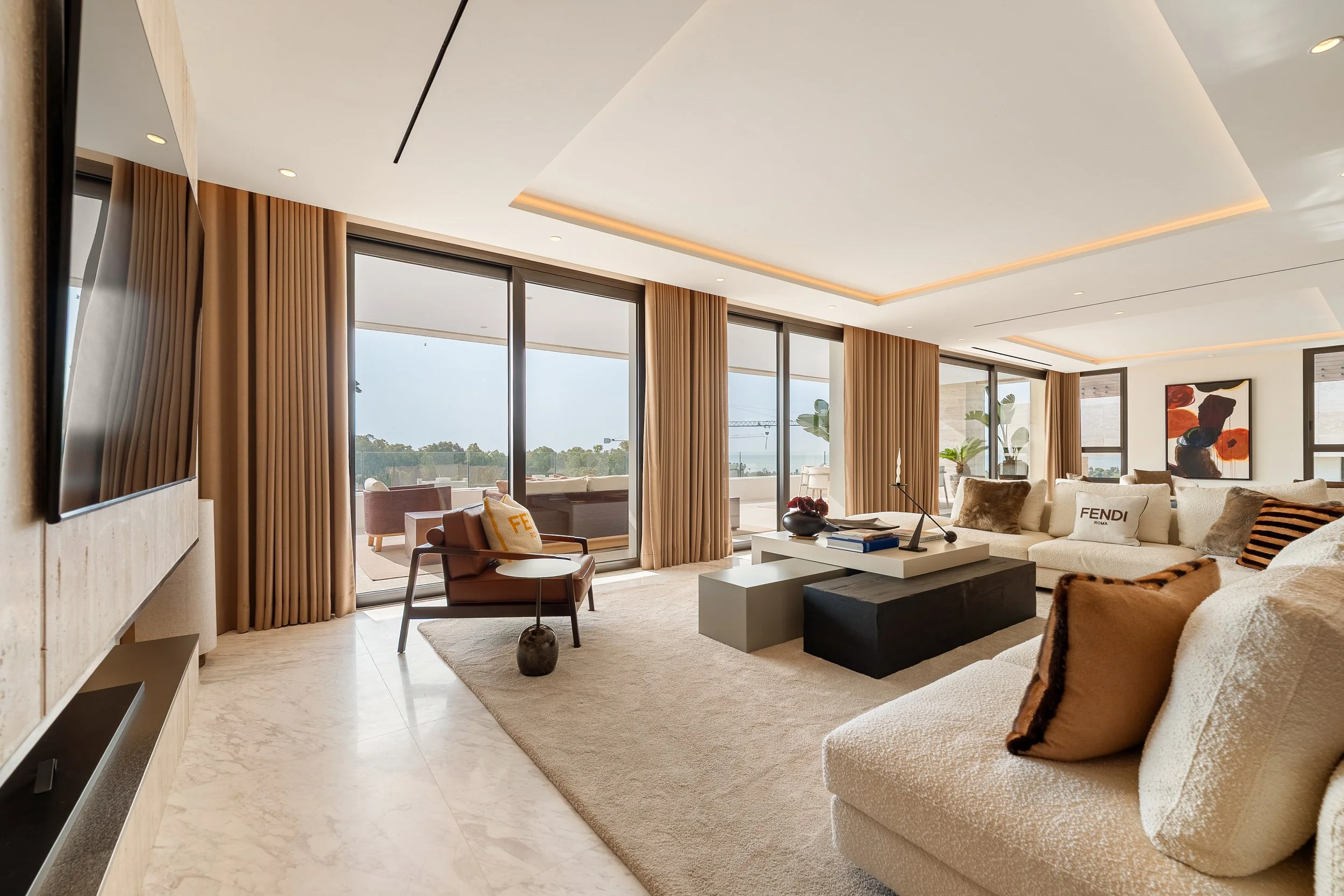 Expansive open-plan living room with marble flooring and terrace access.