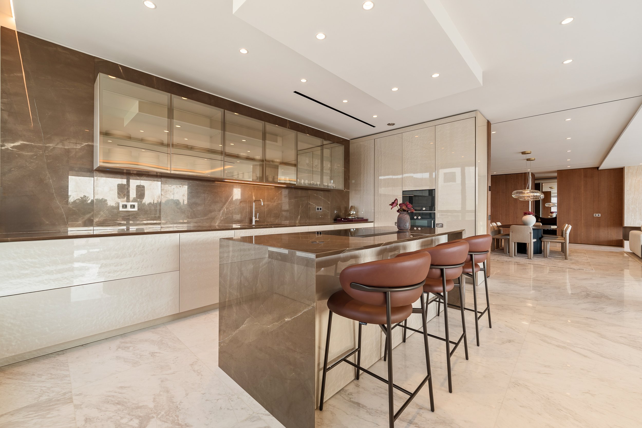 Designer kitchen masterfully furnished by Fendi Casa with premium marble finishes.