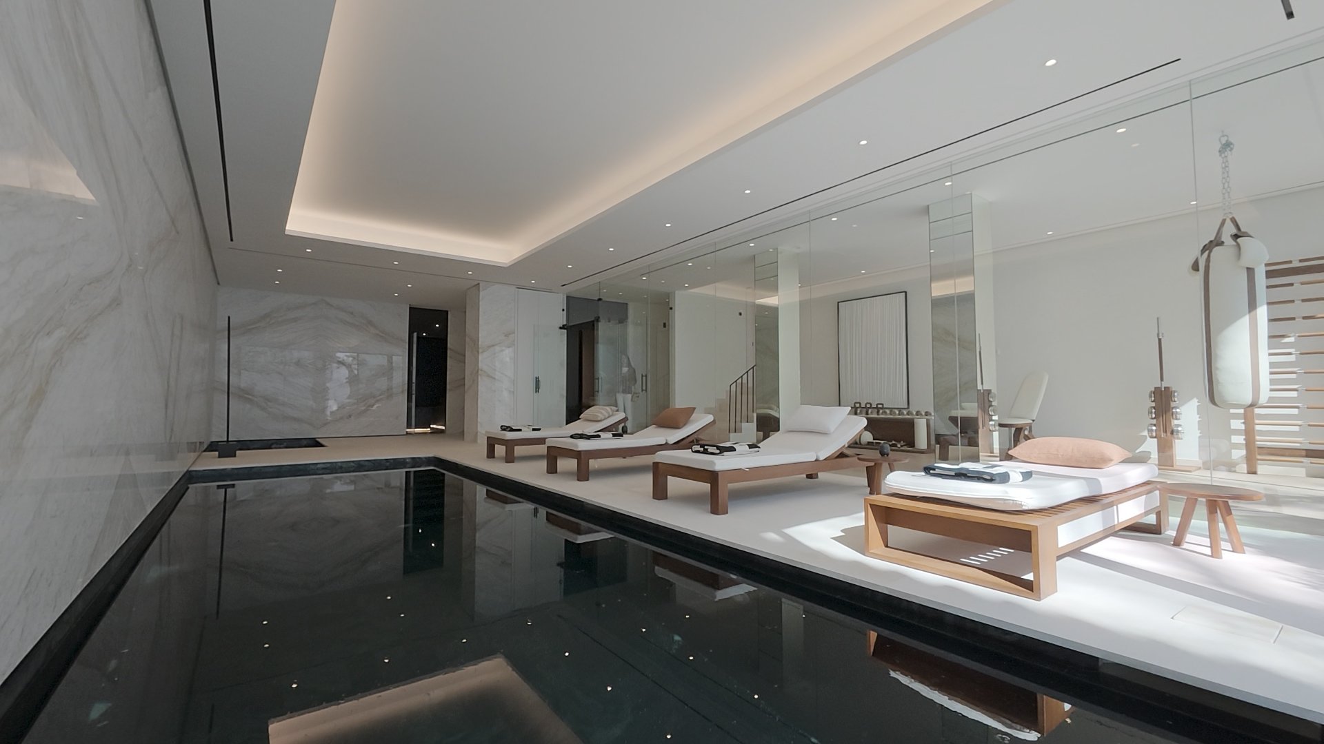 Private Indoor Spa &amp; Pool: An authentic capture of the subterranean wellness center, featuring a heated indoor pool and luxury stone finishes.