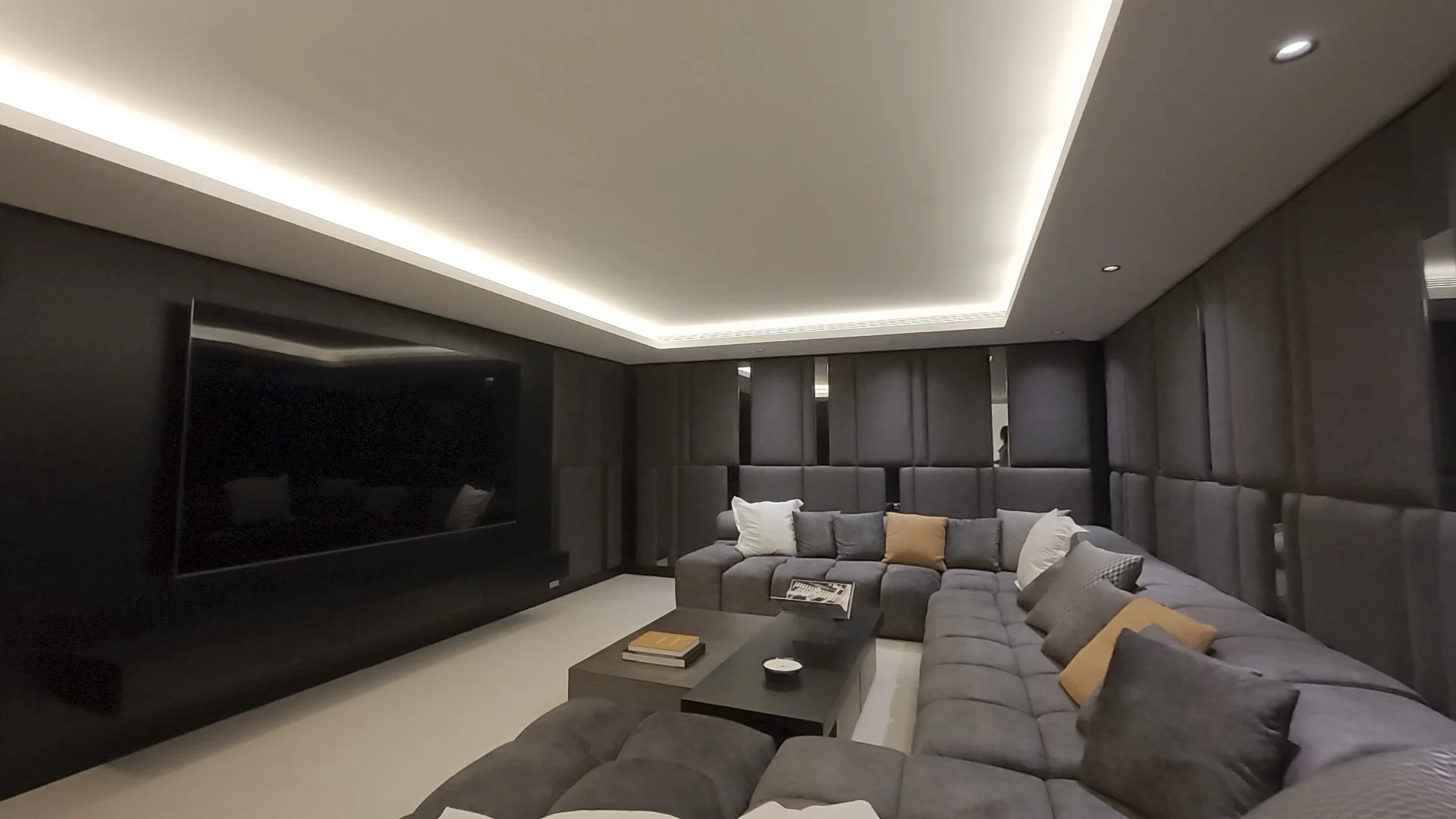 Treatment Room &amp; Cinema: Tour shots showing the private massage/treatment room and the state-of-the-art home cinema with tiered lounge seating.