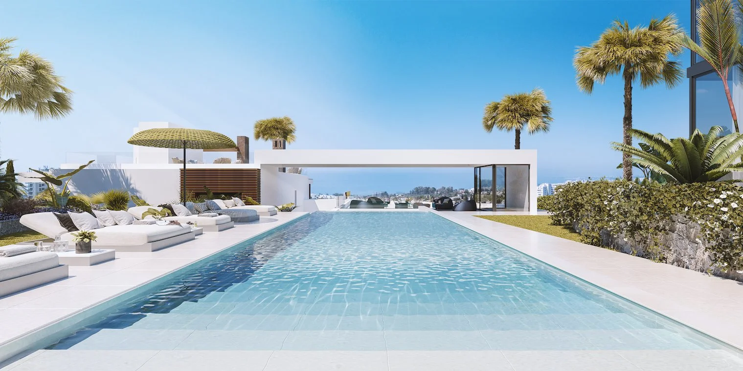 Communal infinity pool and lounge area overlooking the Mediterranean.