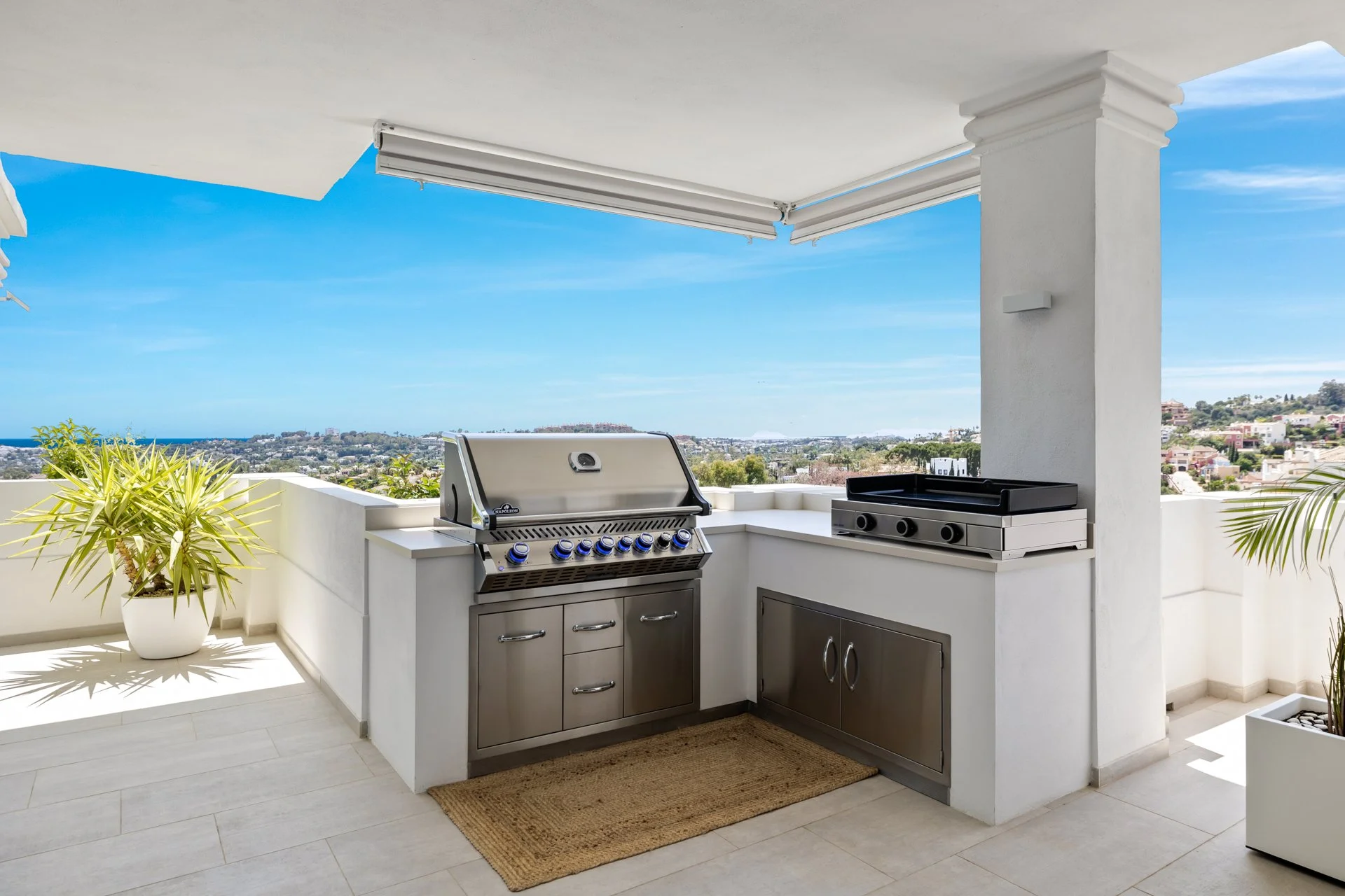 Outdoor summer kitchen with Napoleon BBQ and private Jacuzzi on the terrace.