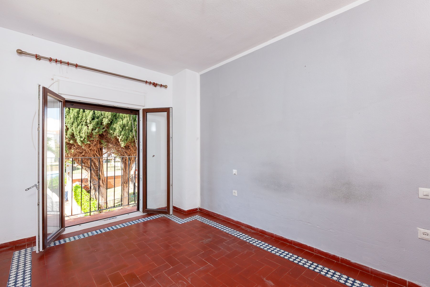 Generous primary bedroom with natural light, showcasing the footprint for a contemporary master suite.