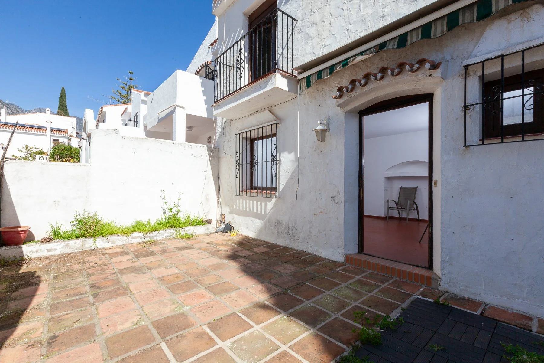 Private outdoor terrace area with authentic Spanish tiling, perfect for creating an alfresco living space