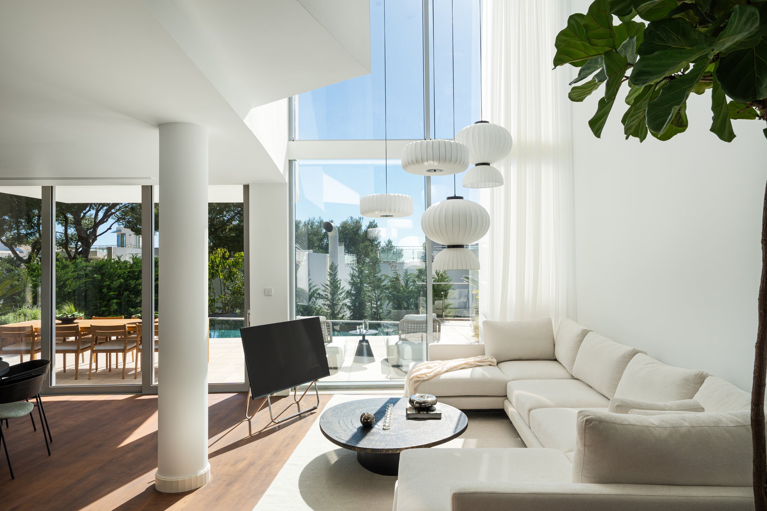 A bright, high-ceilinged living space in Meisho Hills CMH2497S, where the Scandinavian design favors light and proportion.