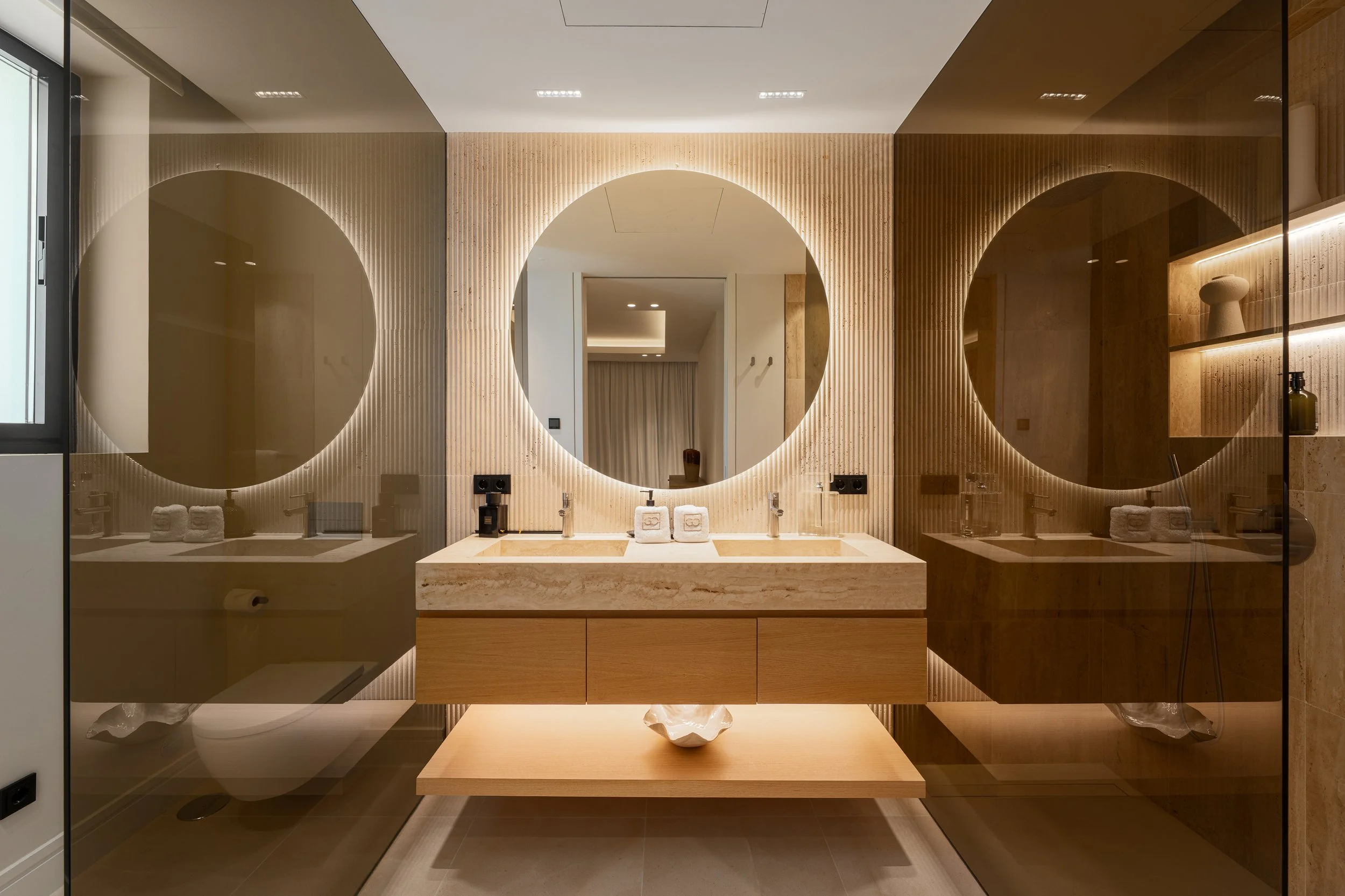 Luxury ensuite bathroom with freestanding soaking tub and designer vanity.